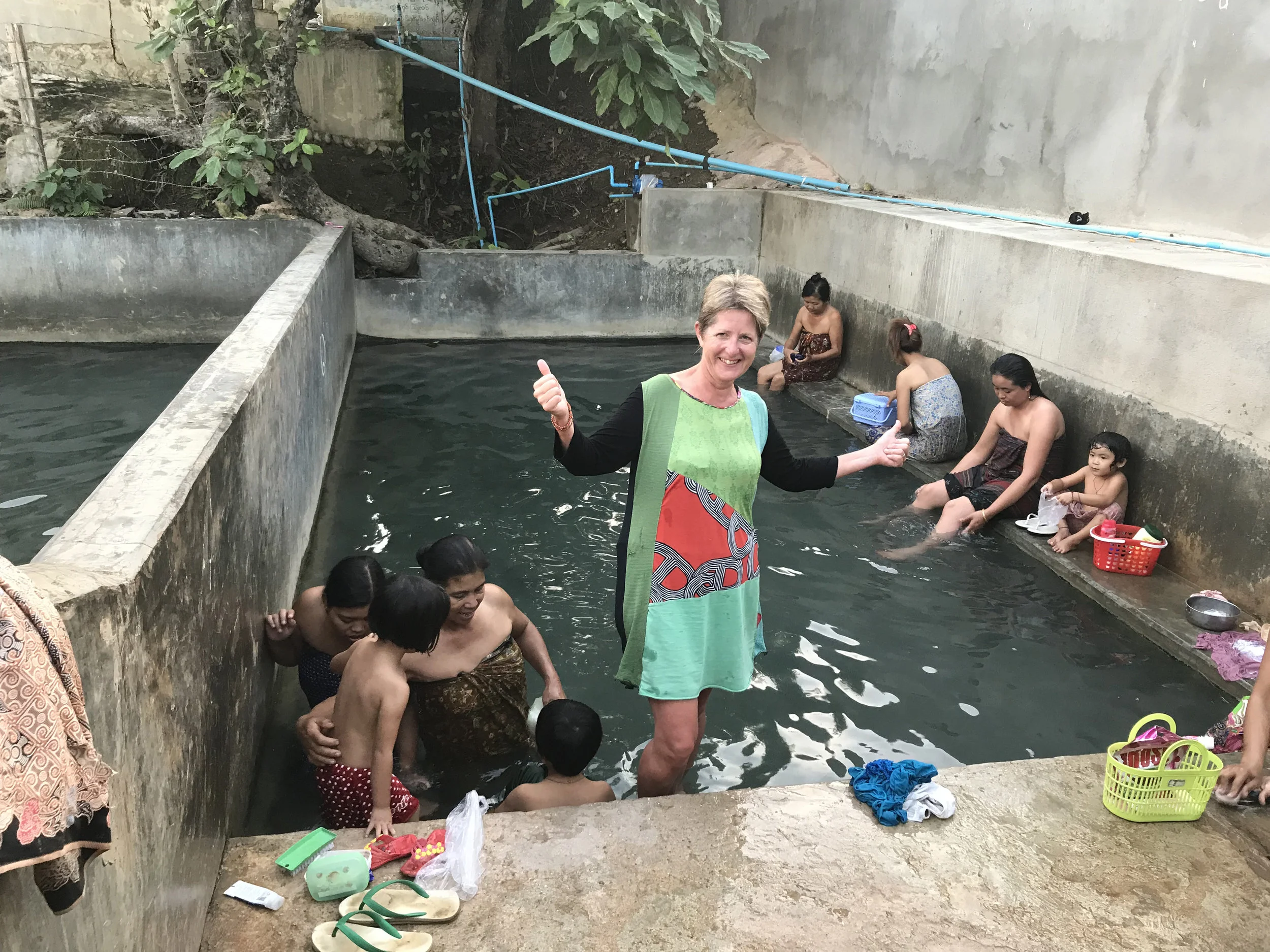 Joining the locals in the hot springs at the end of the trek