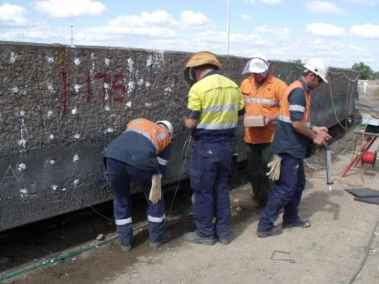 Installation of Hybrid anodes after initial application of dry-process gunite over reinforcement and tank back in service.