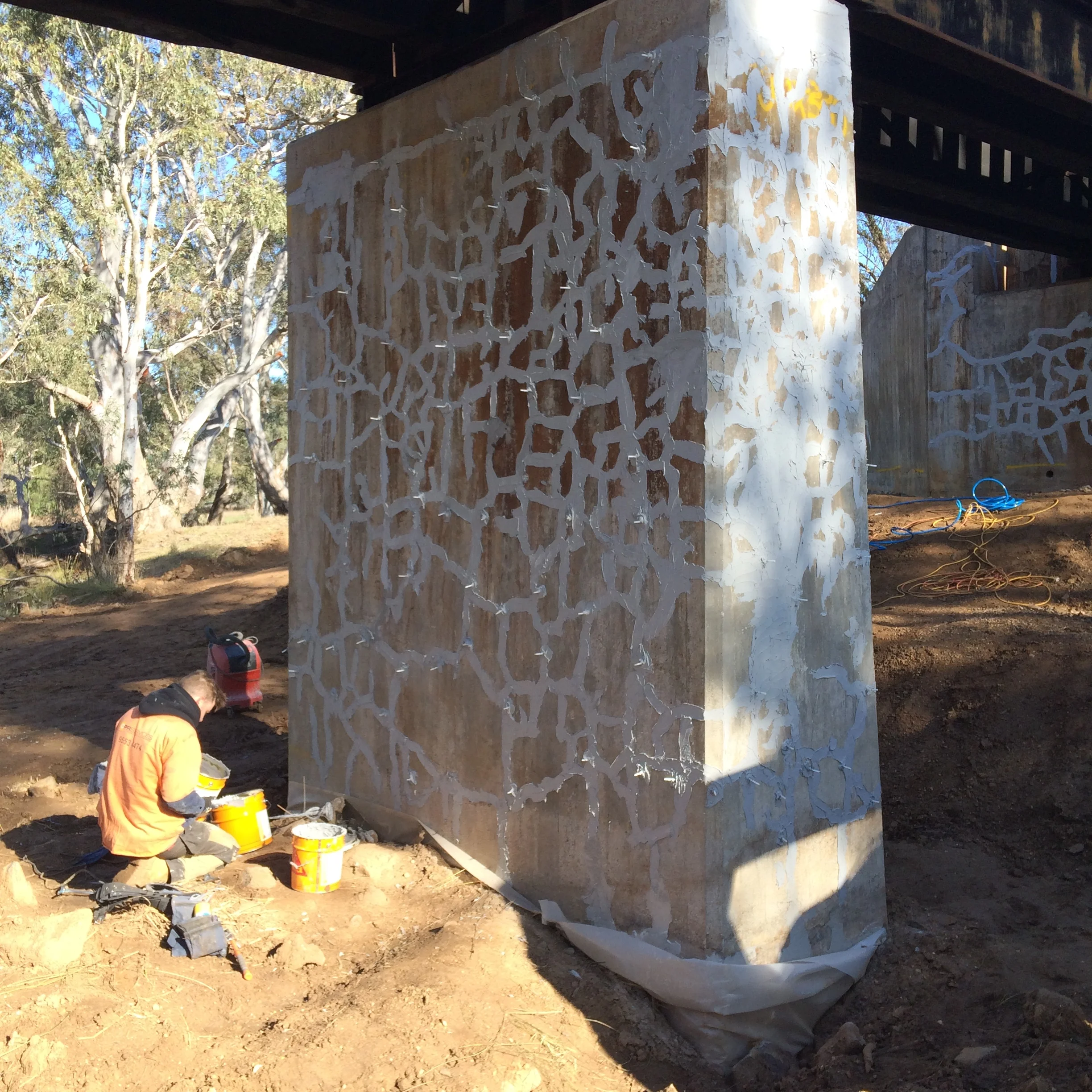 Concrete column being prepared for crack injection.