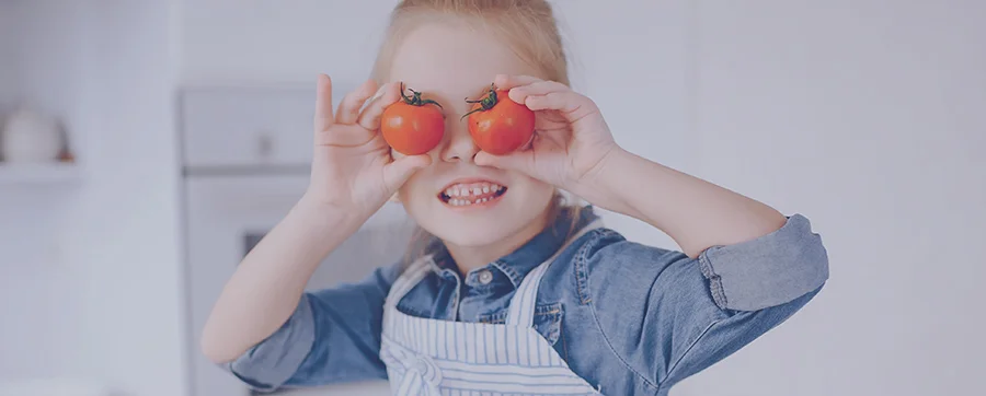 kid-with-tomatoes.jpg