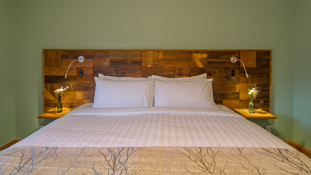 Rimu Feature Headboard with External Cladding salvaged and reused from house.jpg