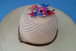 Frederick is on top of the hat.