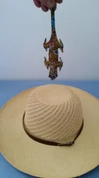 Lizzie is above the hat.