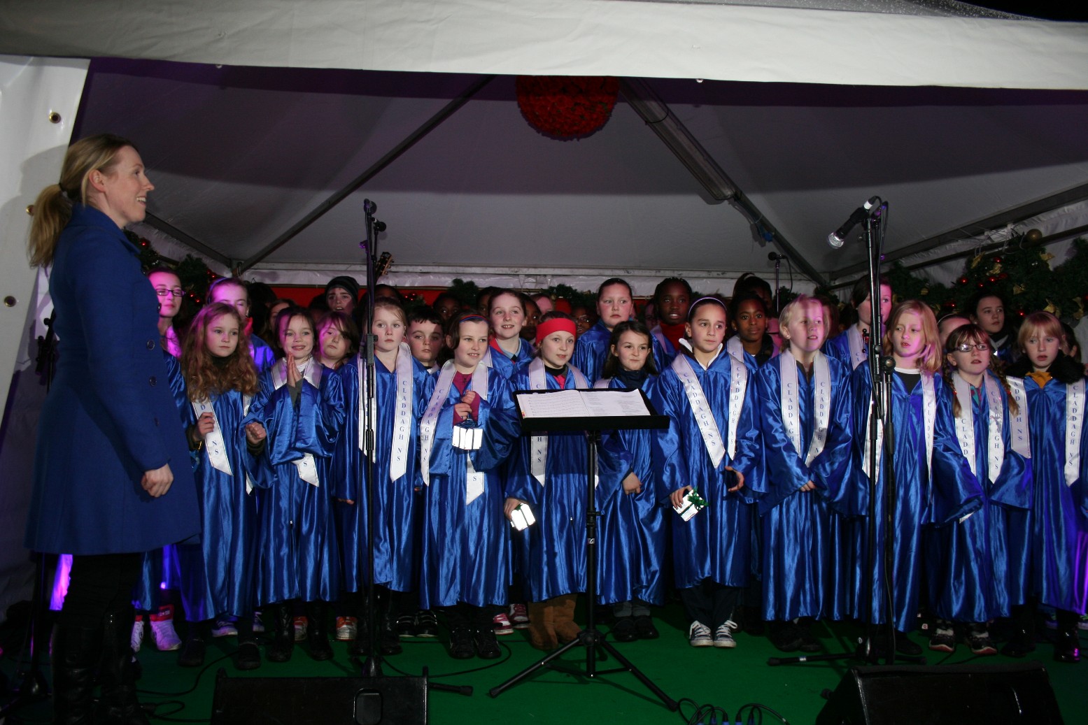 2012 - Choir Xmas Market opening Nov 3 - Rosie and choir.JPG