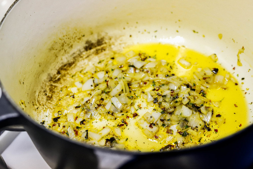 sauteing onions and herbs for homemade easy vegan and gluten-free tomato soup