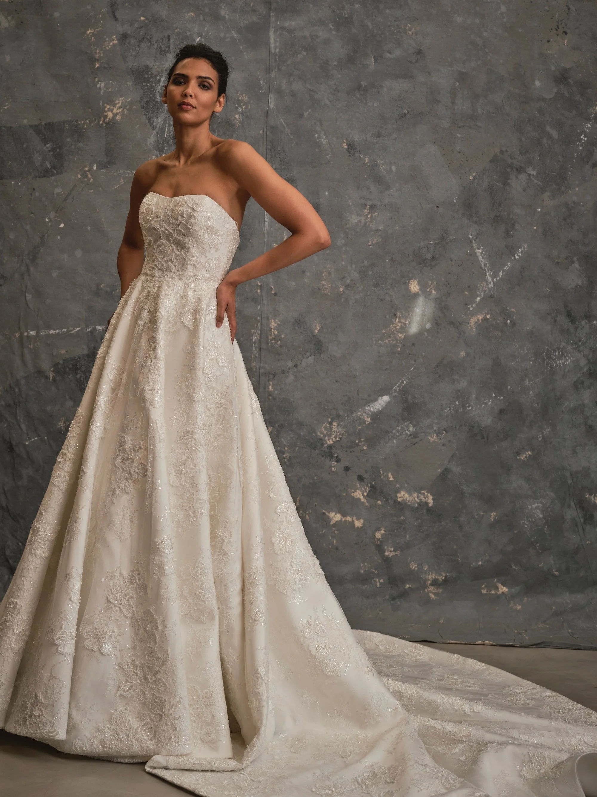 Couture beaded lace wedding dress with sweetheart neckline, full skirt and chapel train