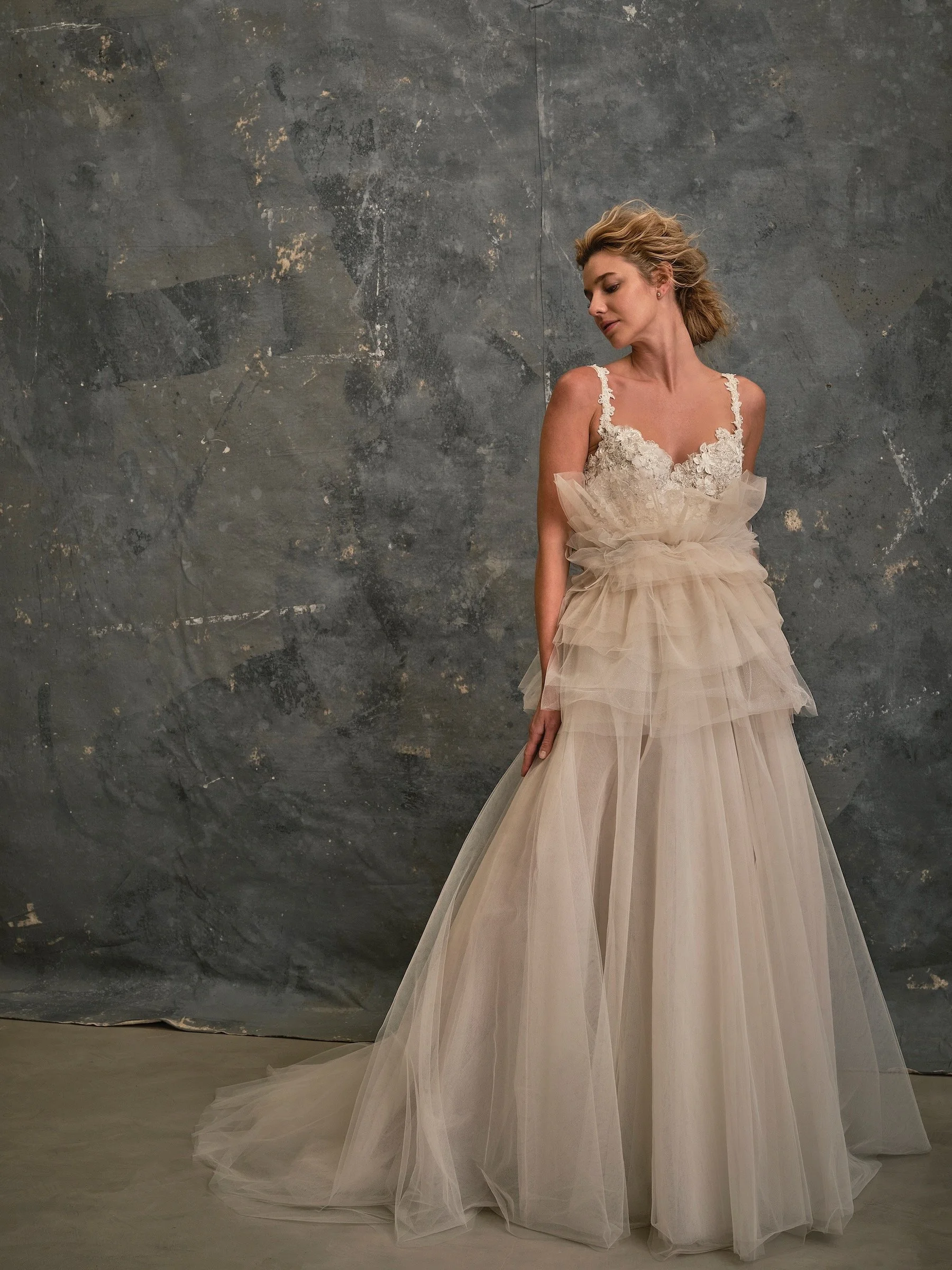 Ballerina wedding dress with floral lace bodice and layered tulle overskirt at The Couture Gallery London
