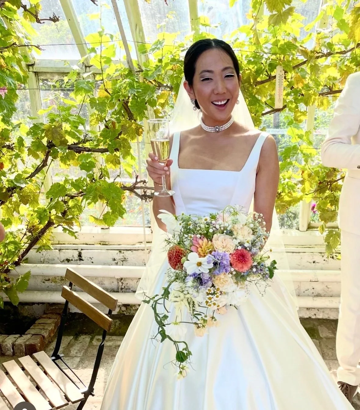 Real Bridel Celine wearing a square neck satin corset wedding dress by The Couture Gallery at her country wedding in Sweden
