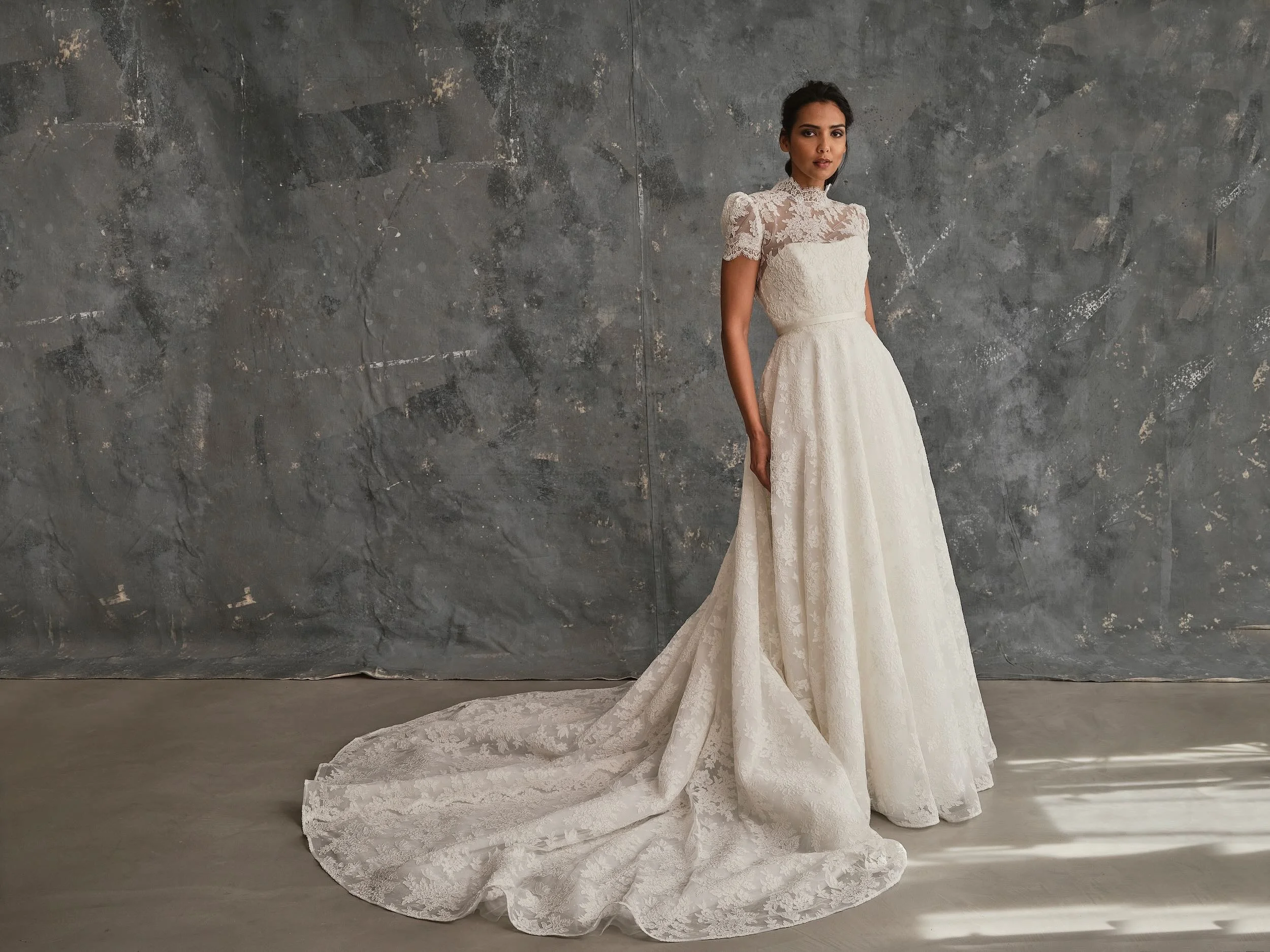 Lace wedding dress with high neck lace overlay and full A-line skirt