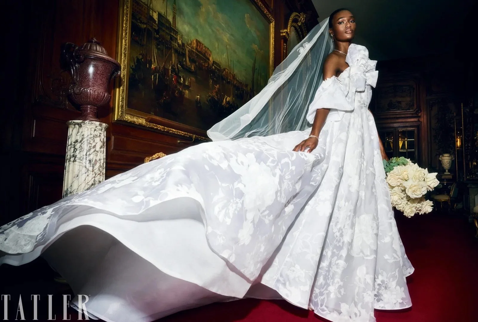 The Lily Modern bridal gown with statement floral organza sleeve, full skirt and elegant train as featured in Tatler Magazine Wedding Guide