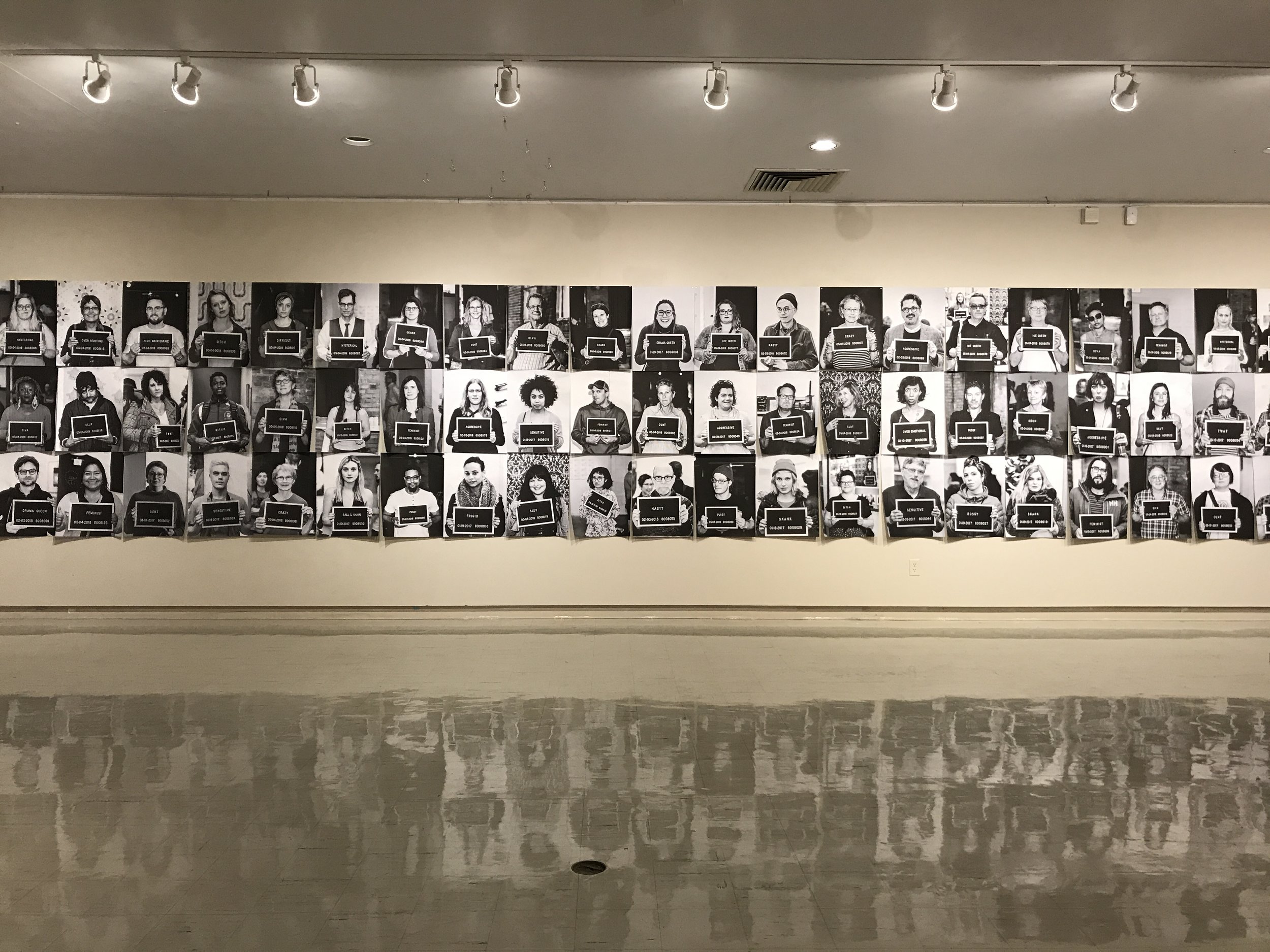  Documentation of how mugshots from previous iterations of this performance were displayed in our solo exhibition  The Pervasive Curse  at the University of Wisconsin-Whitewater’s Crossman Gallery in Spring 2019. 