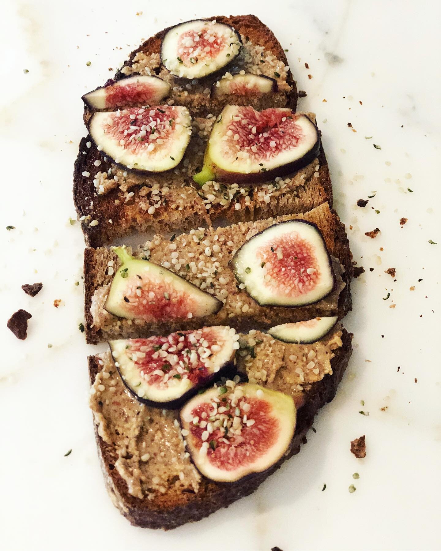 Perfect Start: This toasted whole wheat sourdough with freshly ground raw almond butter + farmers market figs, generously sprinkled with raw hempseeds, makes the most delicious breakfast. Not shown here is the cup of plain Greek yogurt + figs that ad