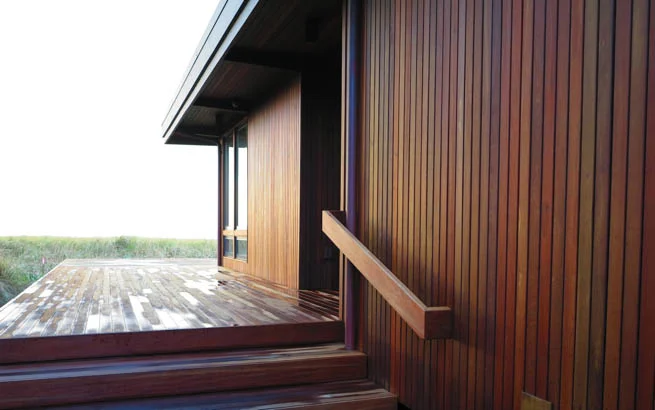 At the front entrance, a long vista extends toward the ocean. Note the details of the ipe handrail to match.