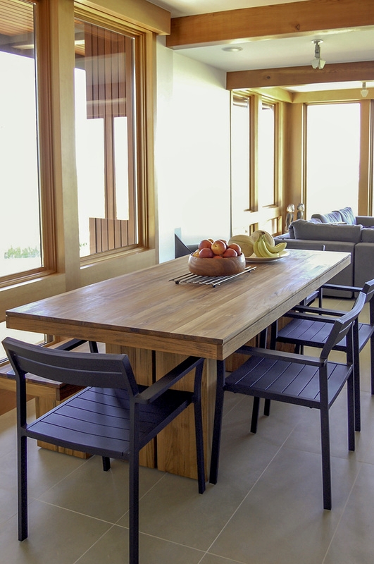 The dining room table was chosen from Design Within Reach for the ability to take it outside to the deck for dining—occasionally outdoor furnishings transfer well to the interior of a home.