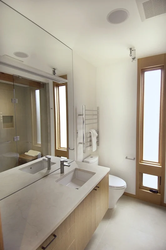Both bathrooms feature marble countertops, heated towel warmers, and the master bath boasts a steam shower. 