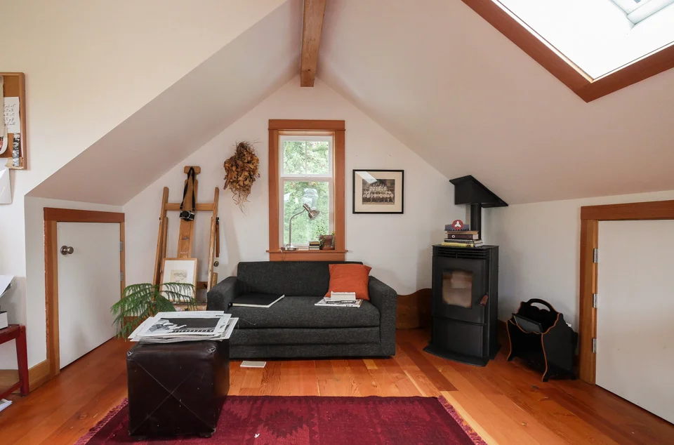 We added storage in the eaves for files and access to art. A free-standing pellet stove adds ambience and heat as needed.