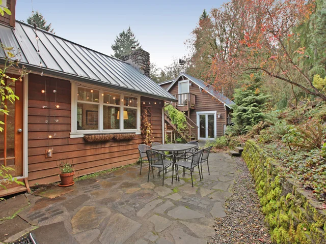 The back patio affords a view of new garage studio space.