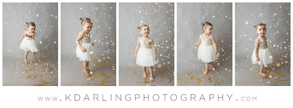 Two year old girl in fancy dress with glitter