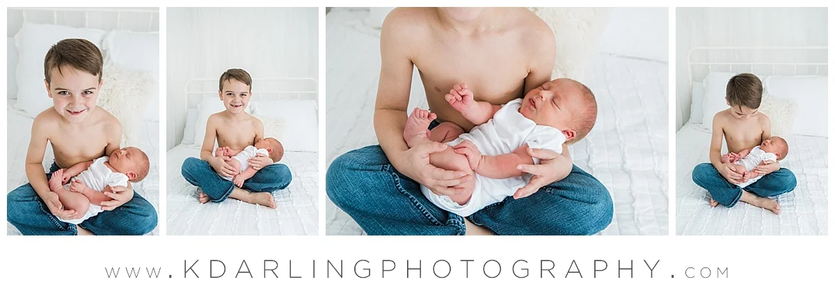 Big brother holding newborn baby brother