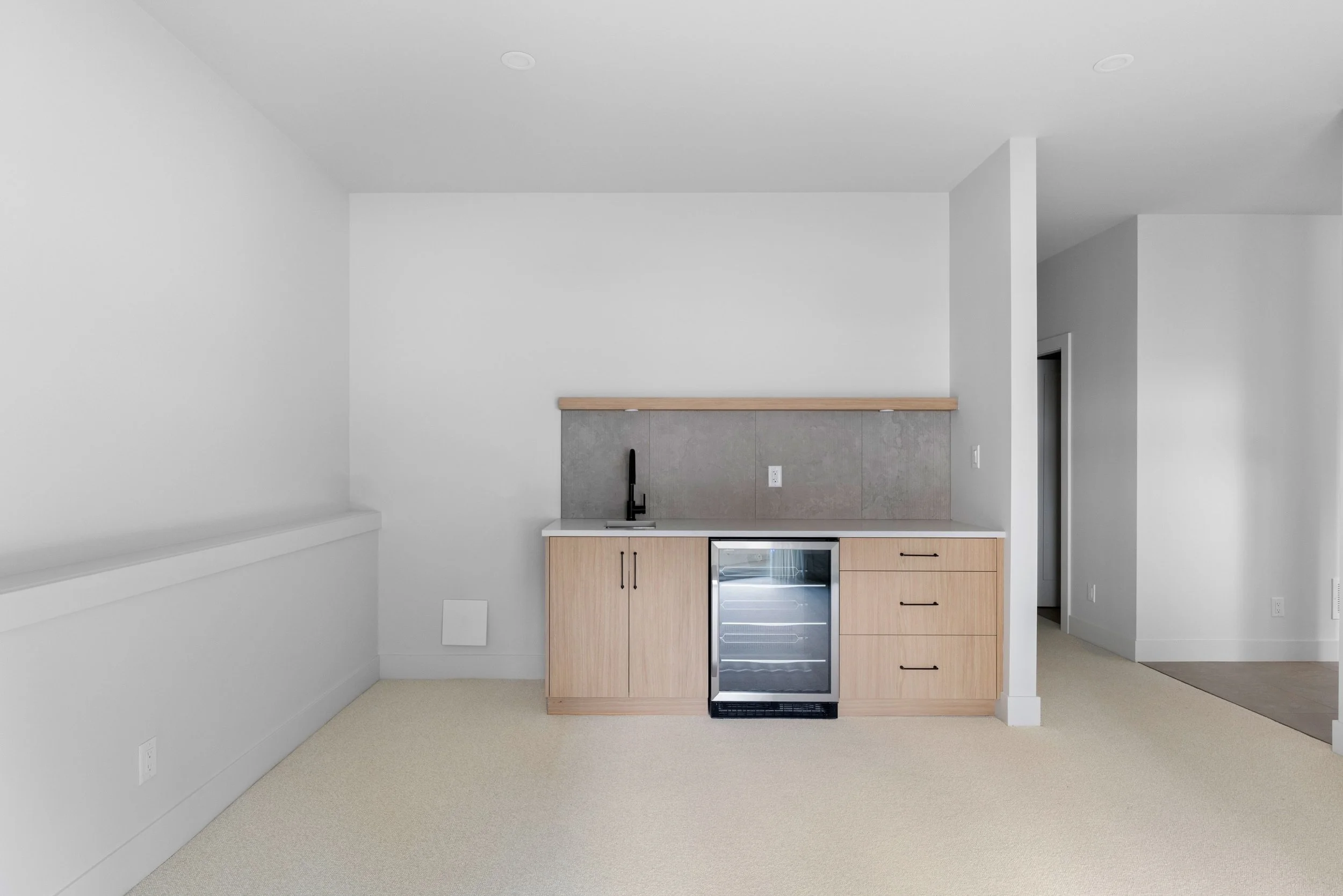 Basement rec room with wet bar.