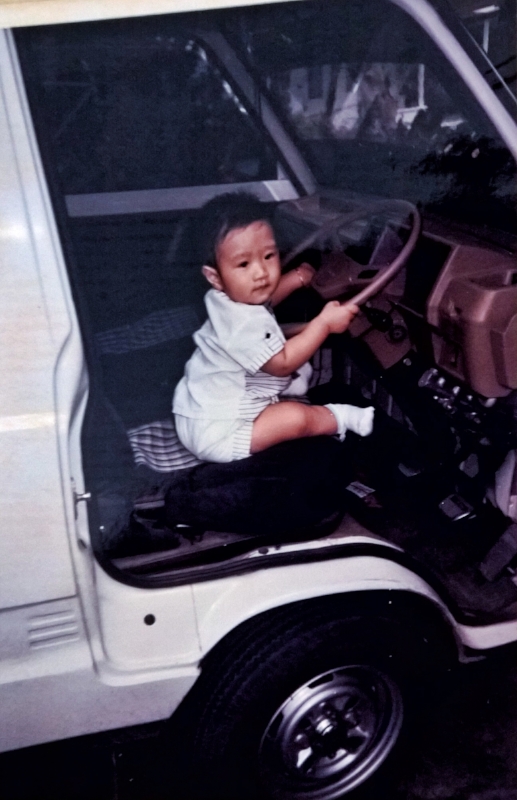 Musa in his first car. Courtesy of Musa Tjahjono.