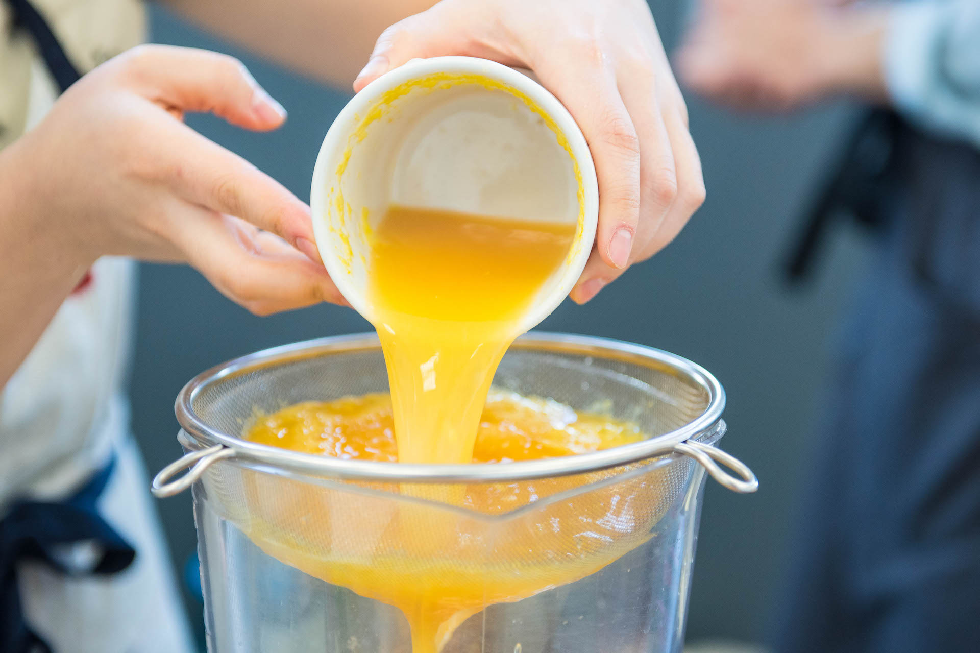 Filtering fresh orange juice.