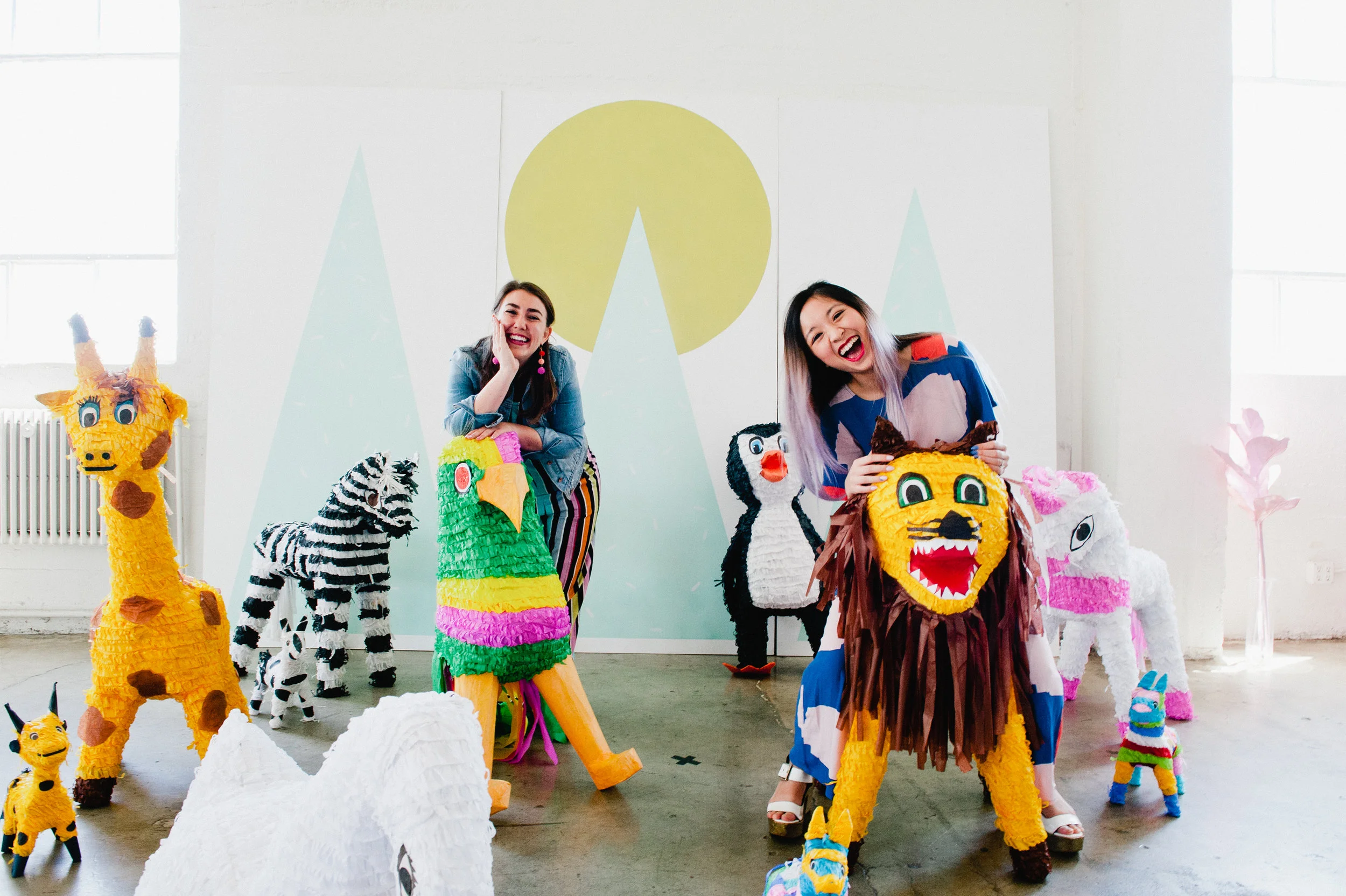 Miraya (left) and Liang (right) at the piñata petting zoo.