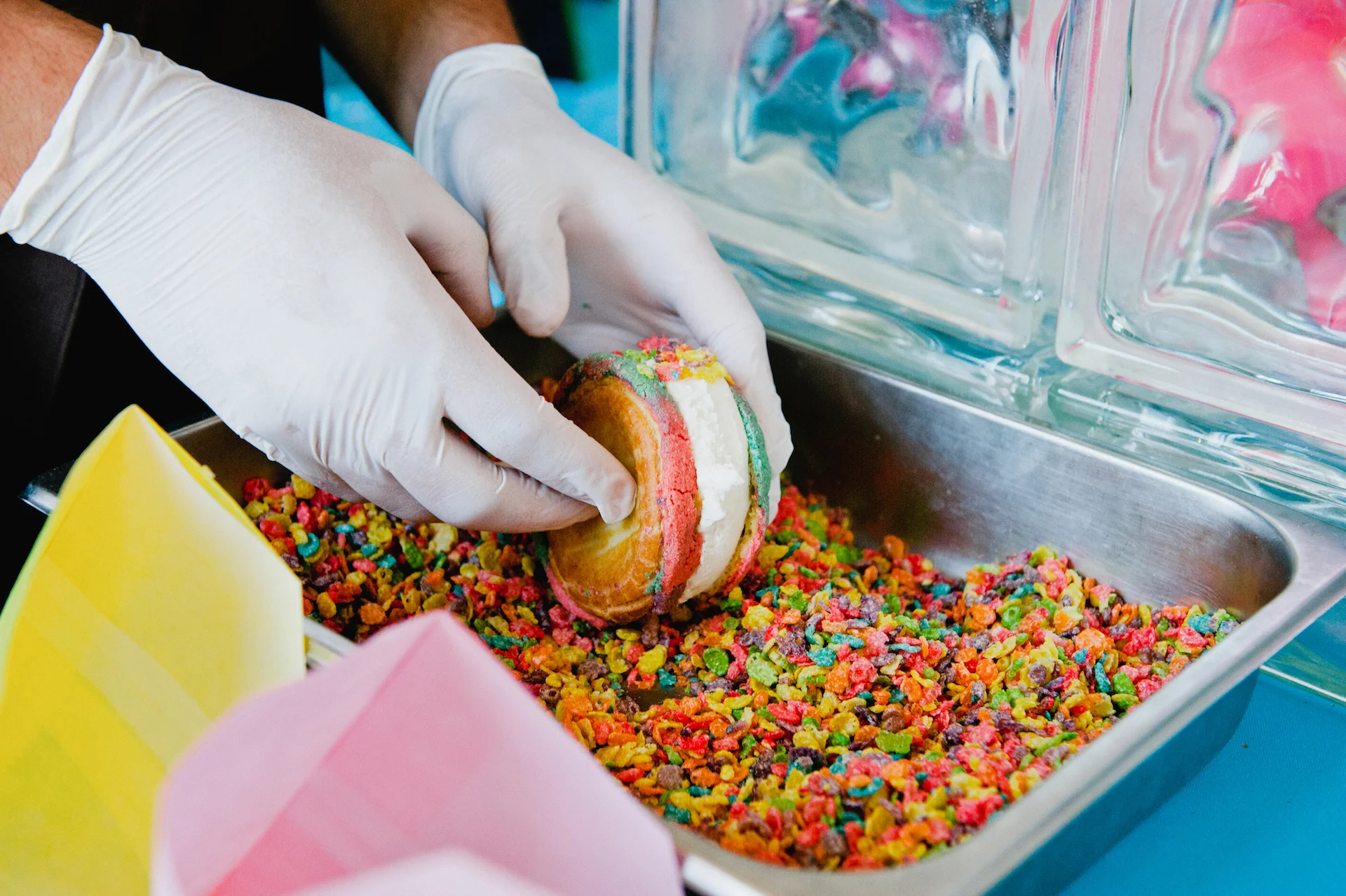 An ice cream sandwich from Puesto made with profiterole concha and colorful cereal.
