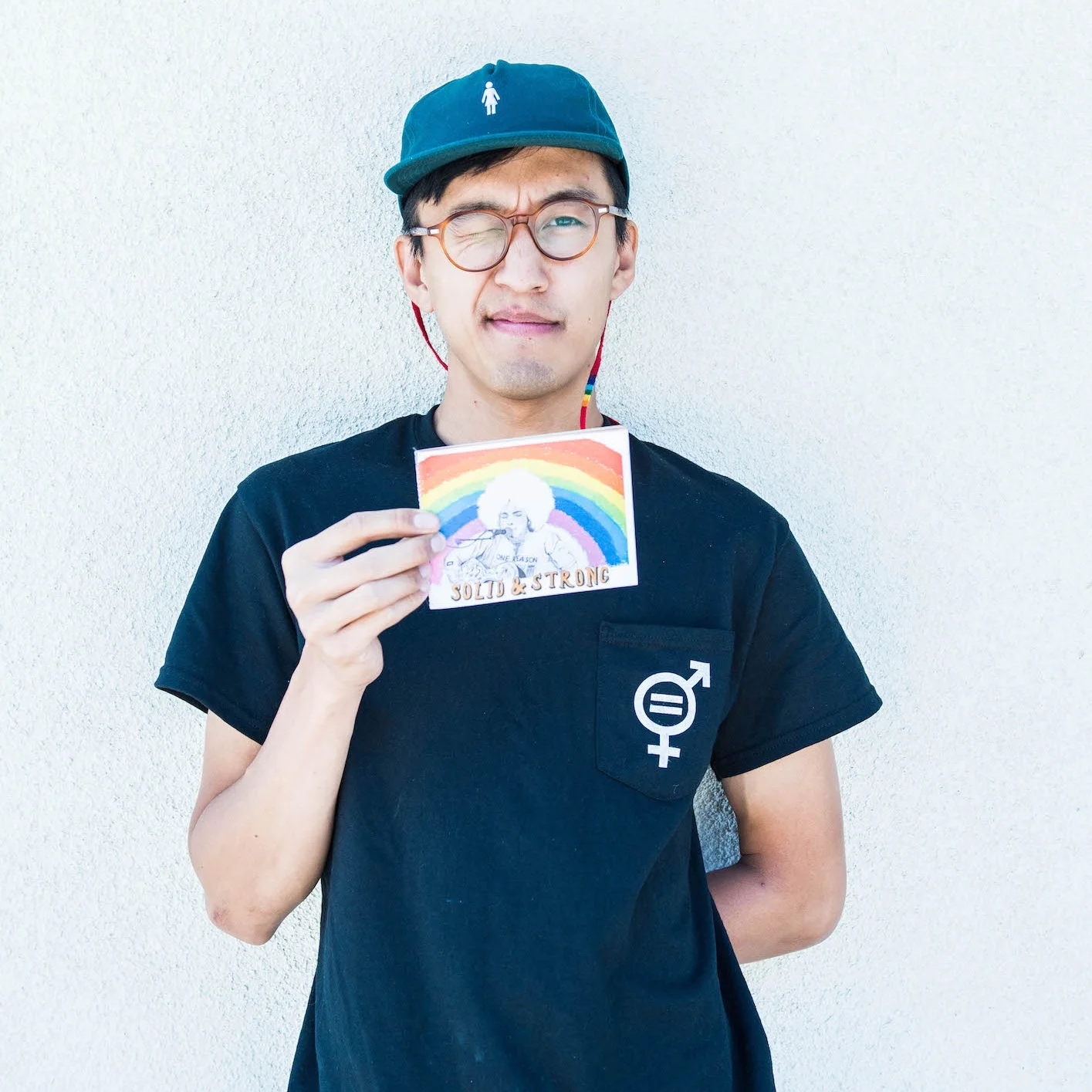 Tony holding up his zine about Kimya Dawson called Solid & Strong .