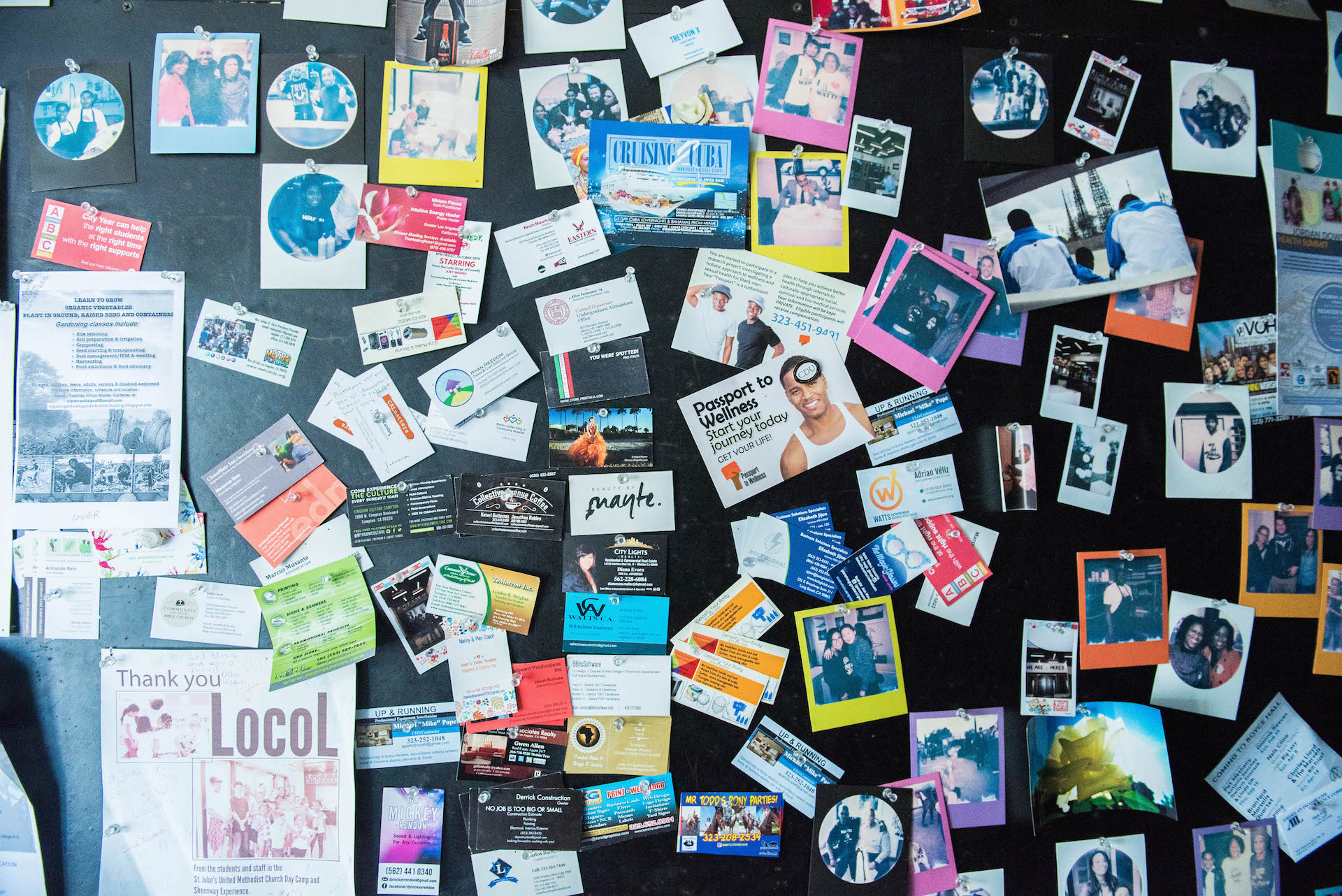 At the back of Locol is a wall just for the community. Business cards, thank you letters, and polaroids of locals adorn the wall.