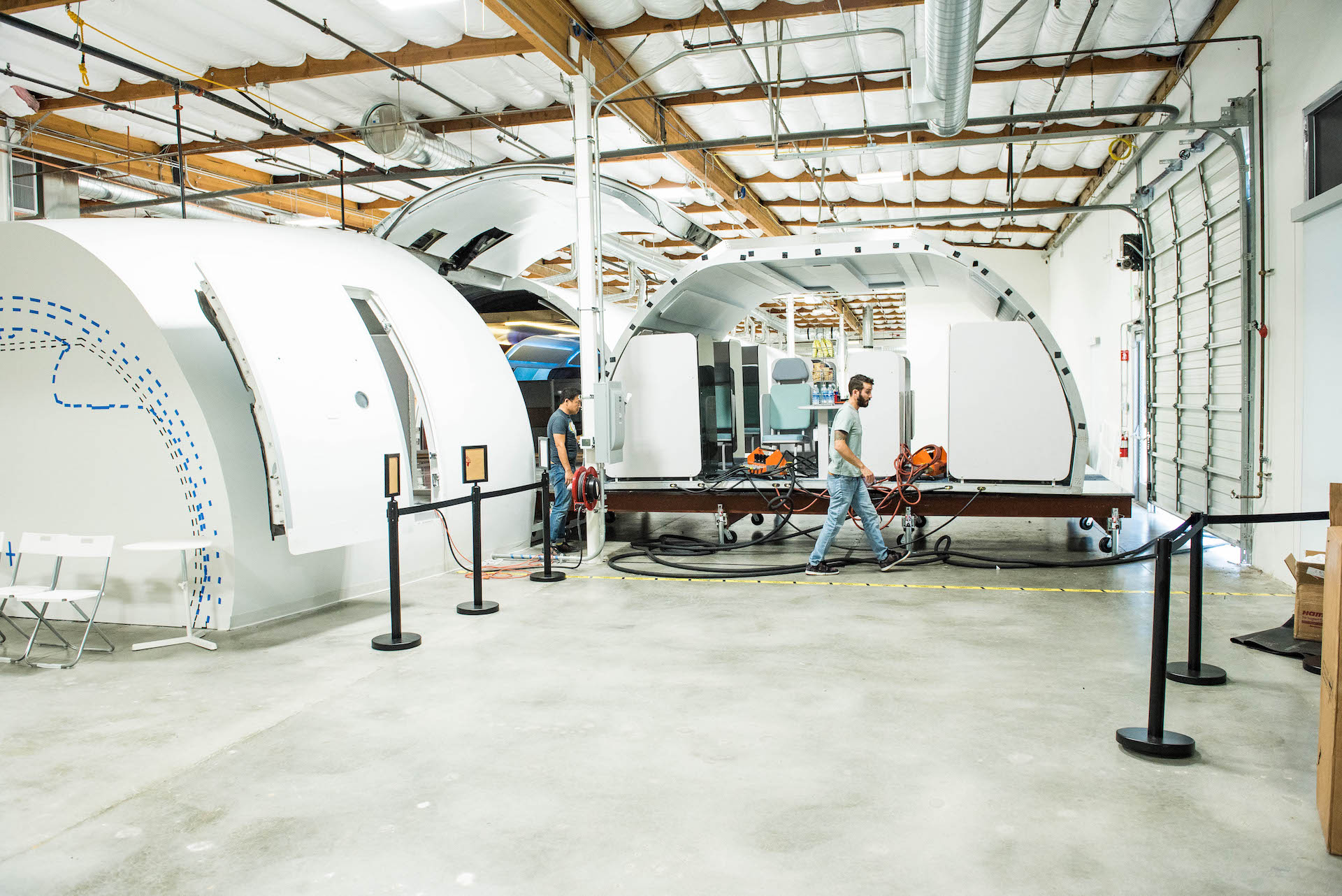 A module fully pushed out. Members of design team prep this particular module to go back into the plane.