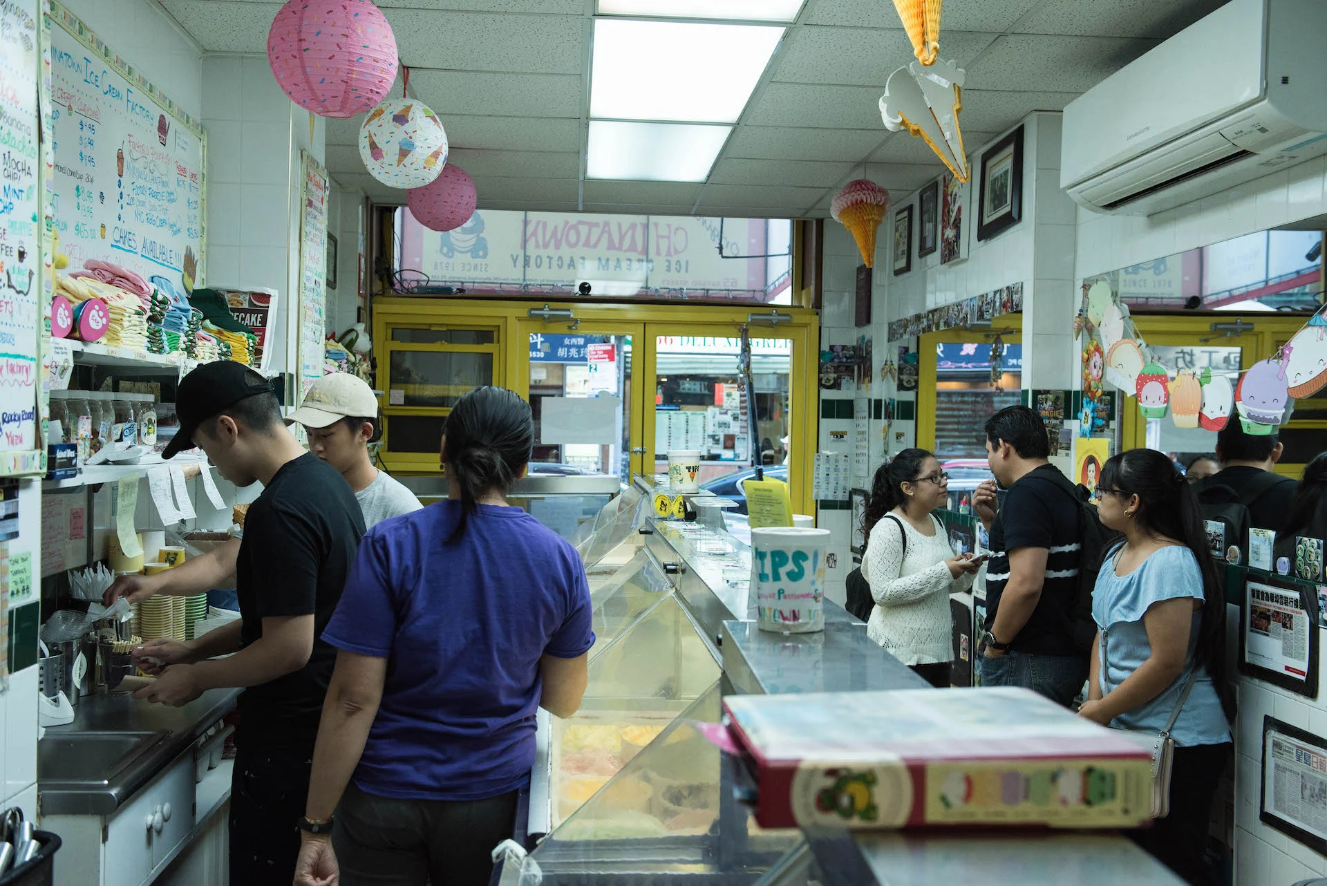 Customers wait for their ice cream at the original Chinatown Ice Cream Factory shop on Bayard Street.