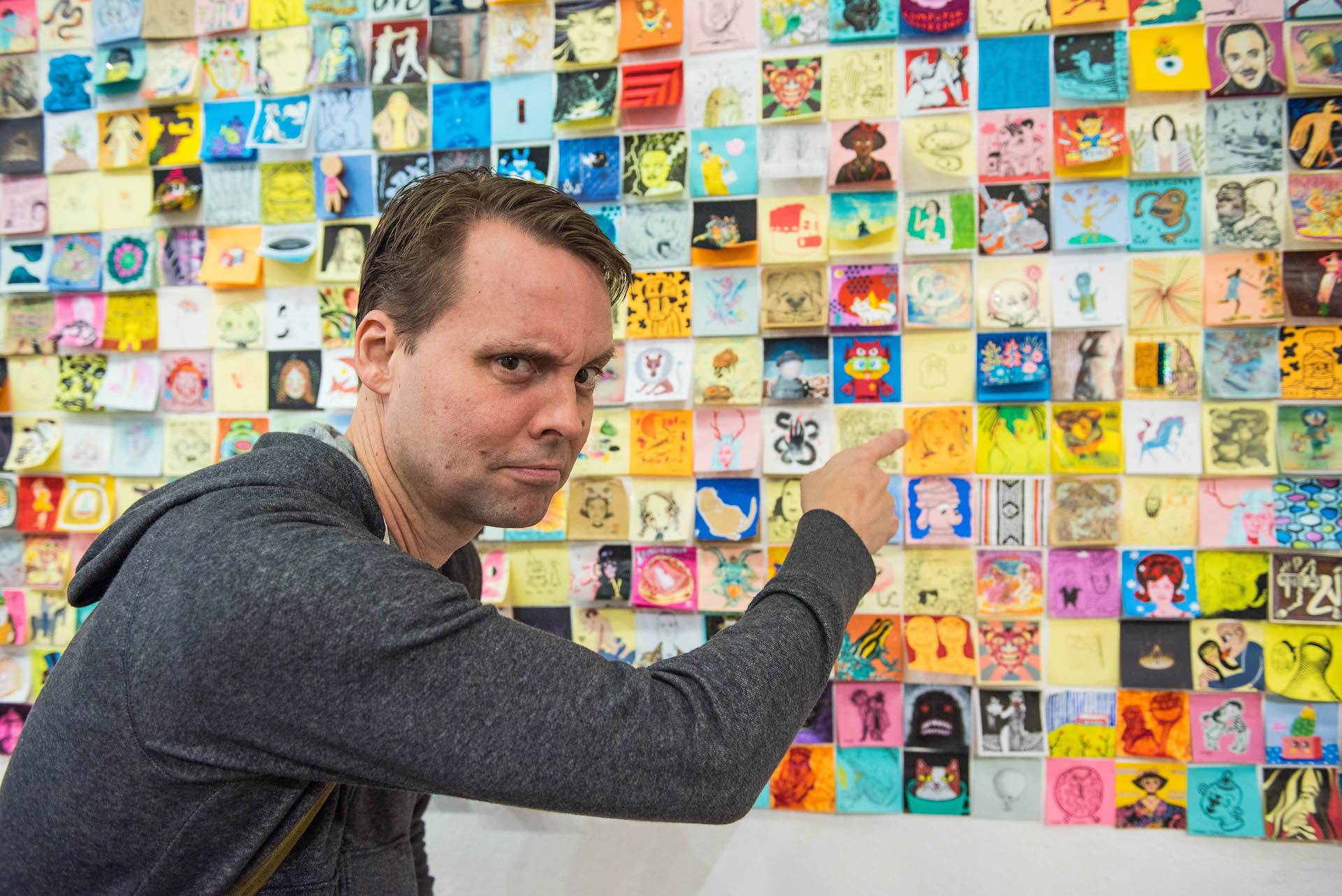 David Horvath, the co-creator of Ugly Dolls, pointing at his post-it.