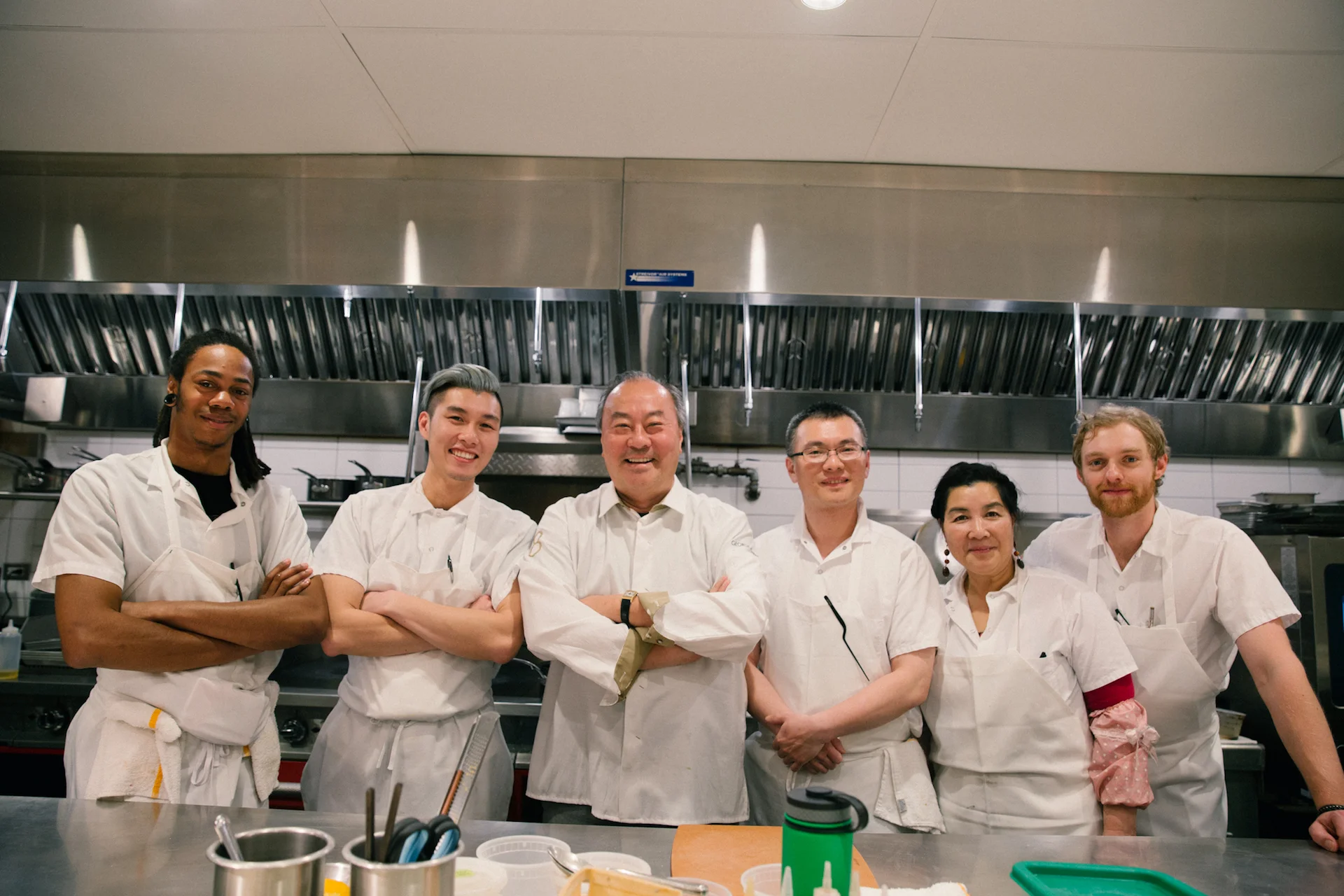 George Chen (center) and the Eight Tables team.