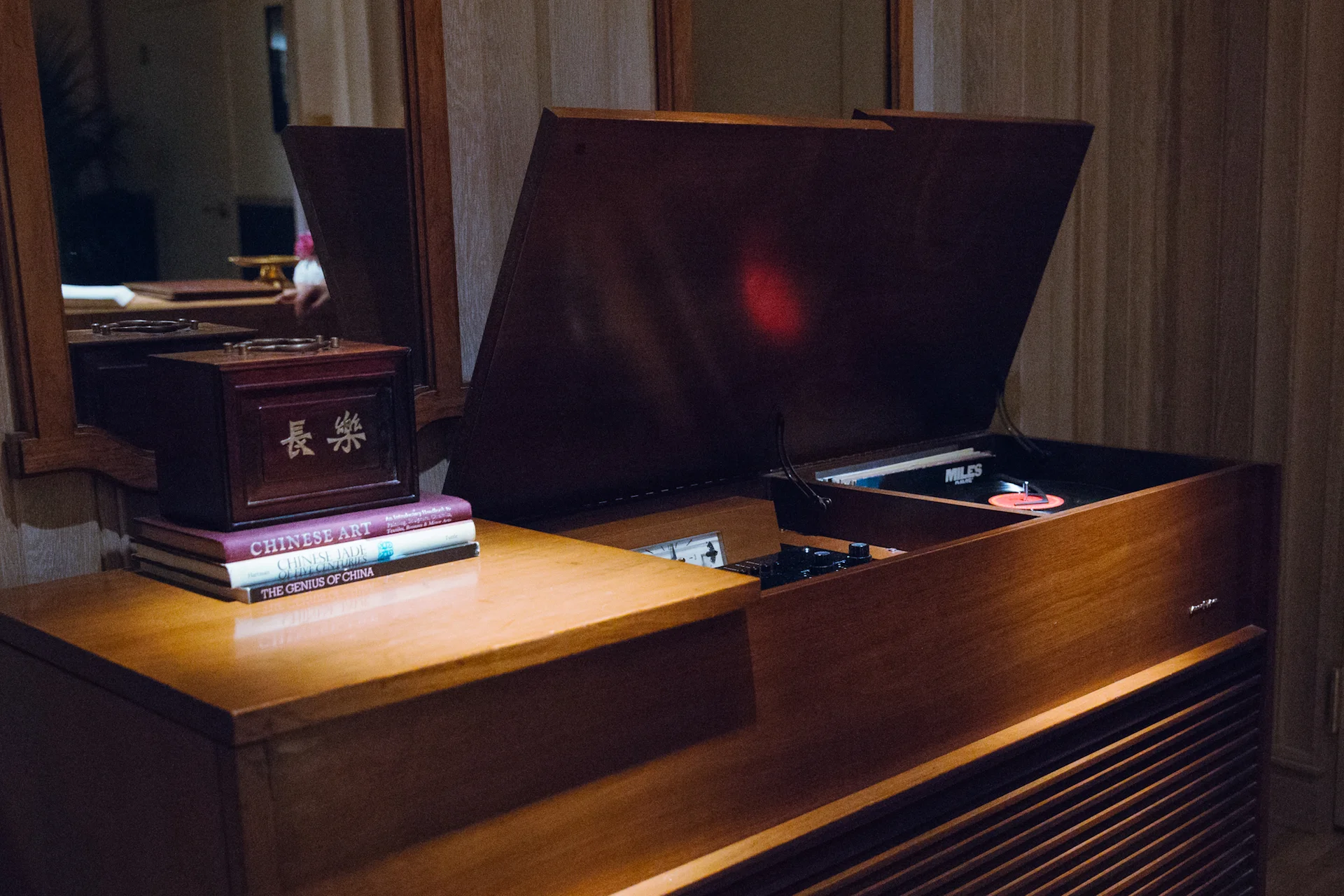 A vintage record player can be found in the foyer.