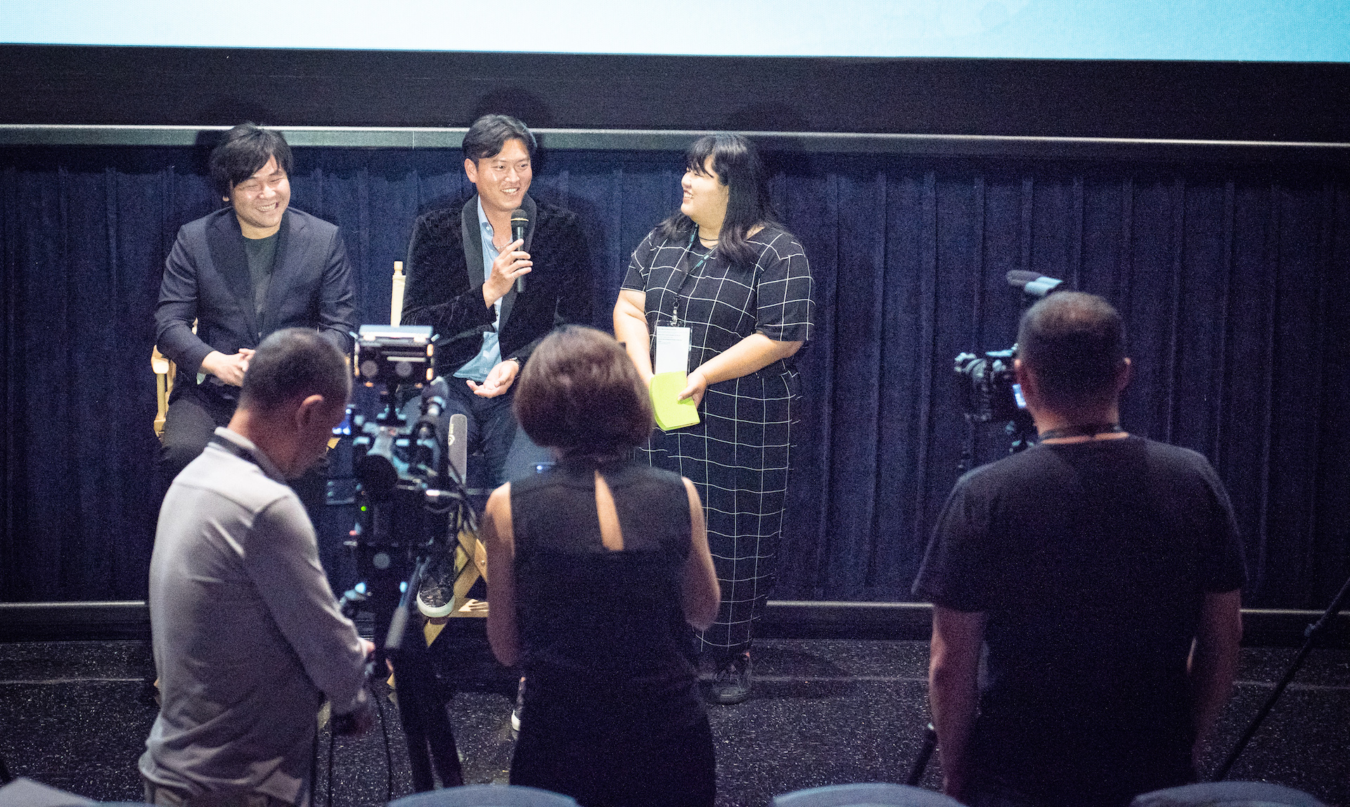 Director Frank W. Chen (left) and Chien-Ming Wang (second to the left) speaking to the audience after the screening.