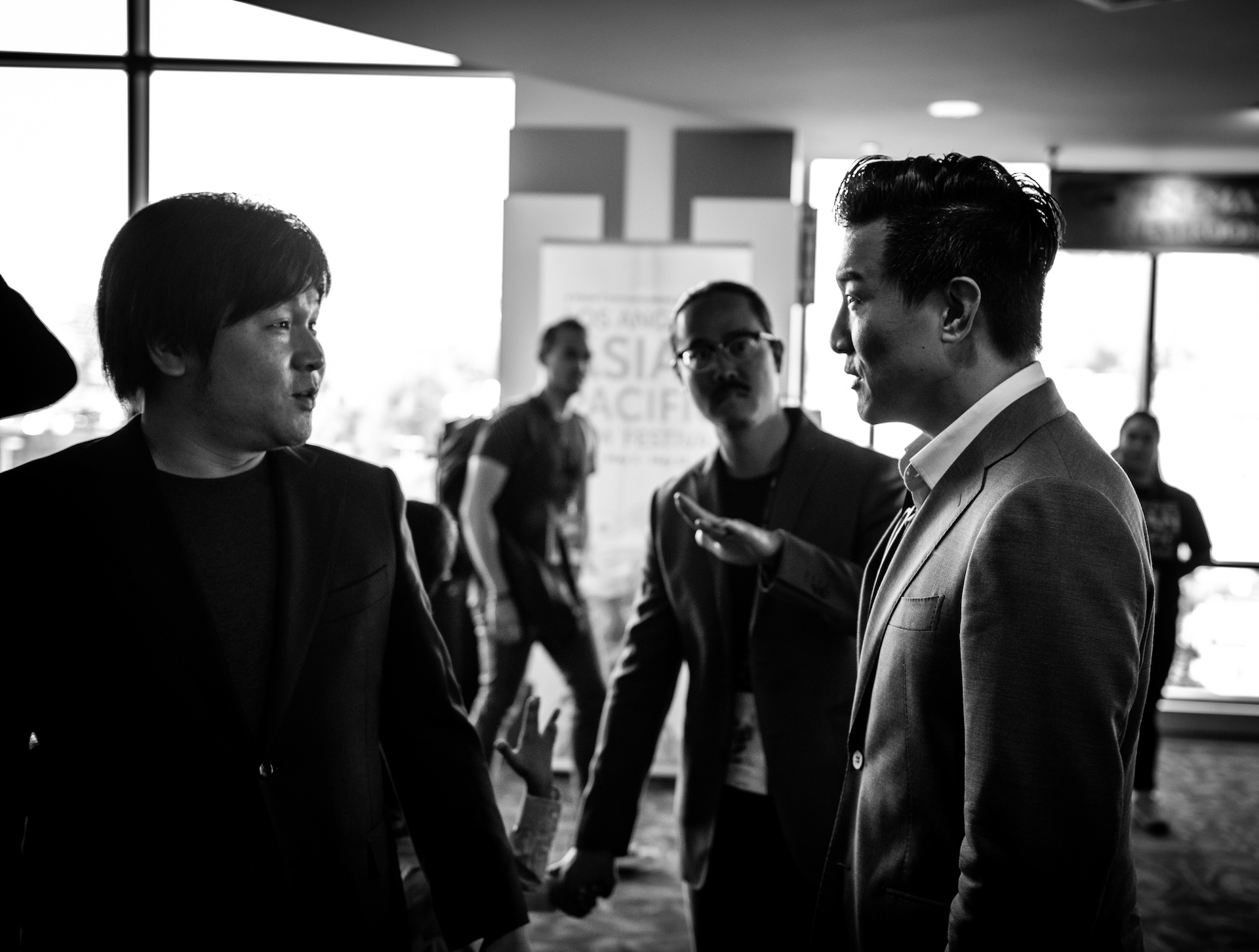 Dir. Frank W. Chen (left) talking with producer Brian Yang (right) before the premiere.