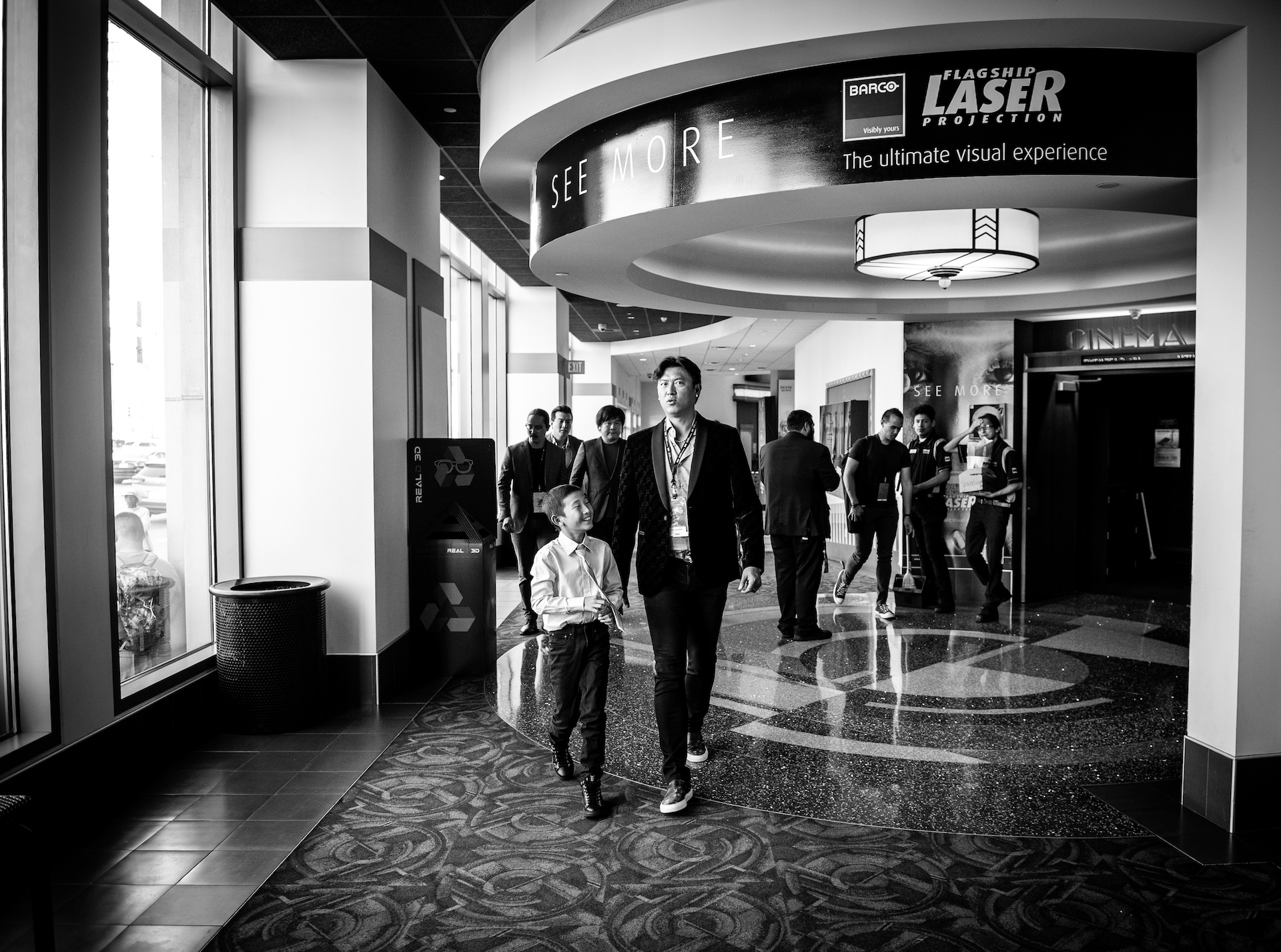 Chien-Ming Wang walking to the theater with his son. Director Frank W. Chen, Cinematographer Hai-Tao Wu, and Producer Brian Yang follow behind them.