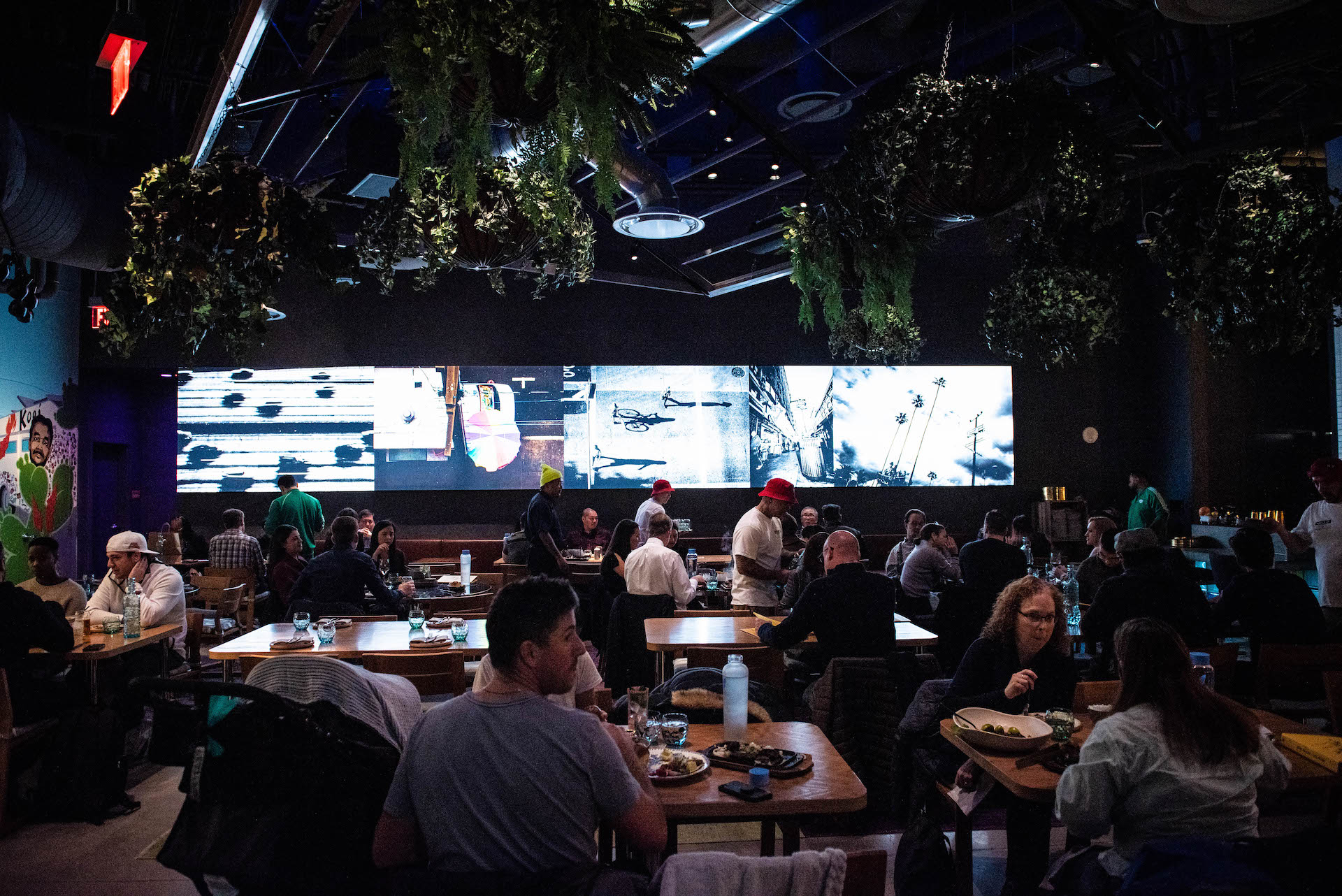 Inside Best Friend’s main dining area. Photos of LA are displayed on the walls.