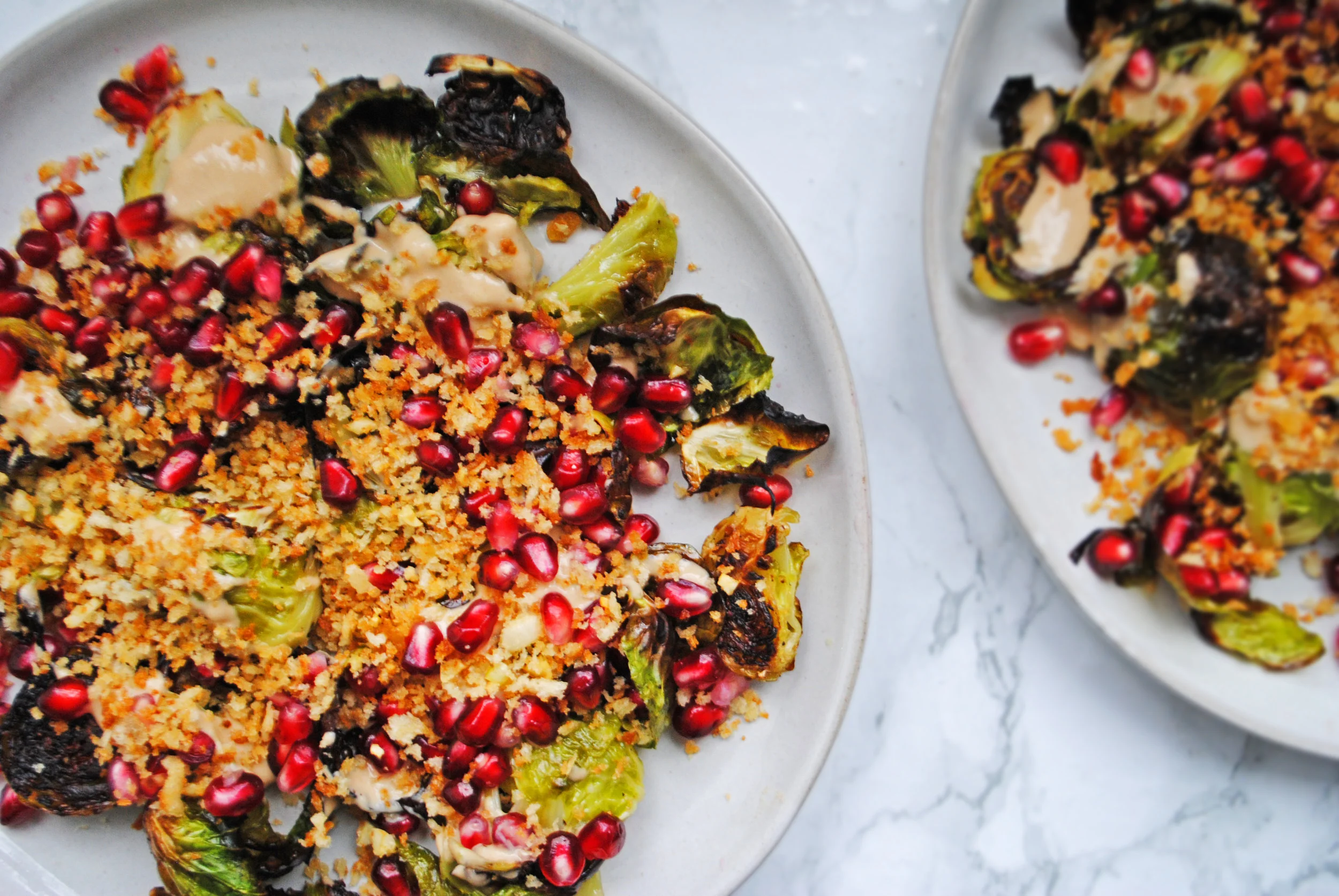 CRISPY SPROUTS WITH TAHINA AND POMEGRANATE