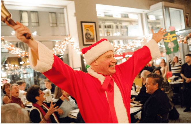 Michael Pollard leading our dining room in our annual 12 Days of Christmas extravaganza 