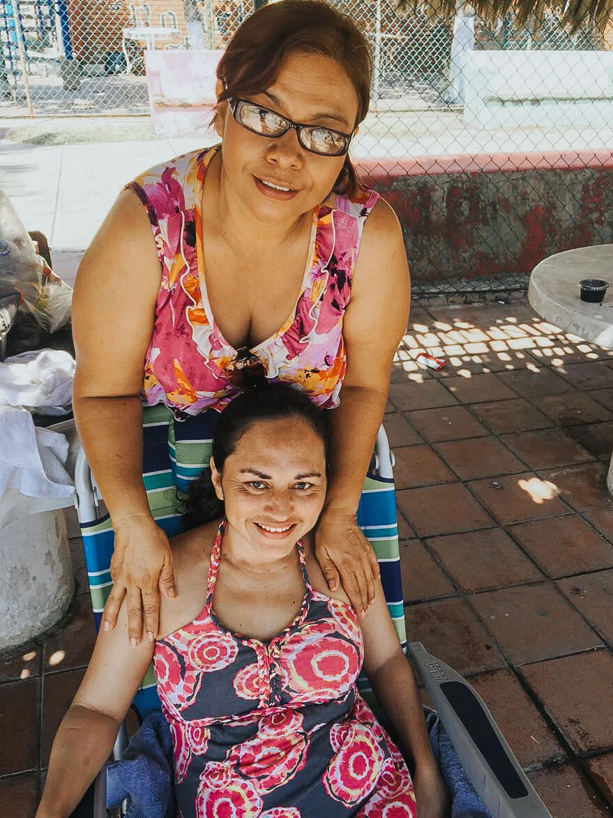 Evelyn, our Program Manager, with Jasmine on their recent beach day.