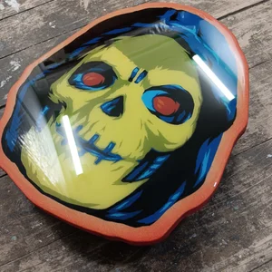 Skeletor spray painted head on cut wood. — EPYON5