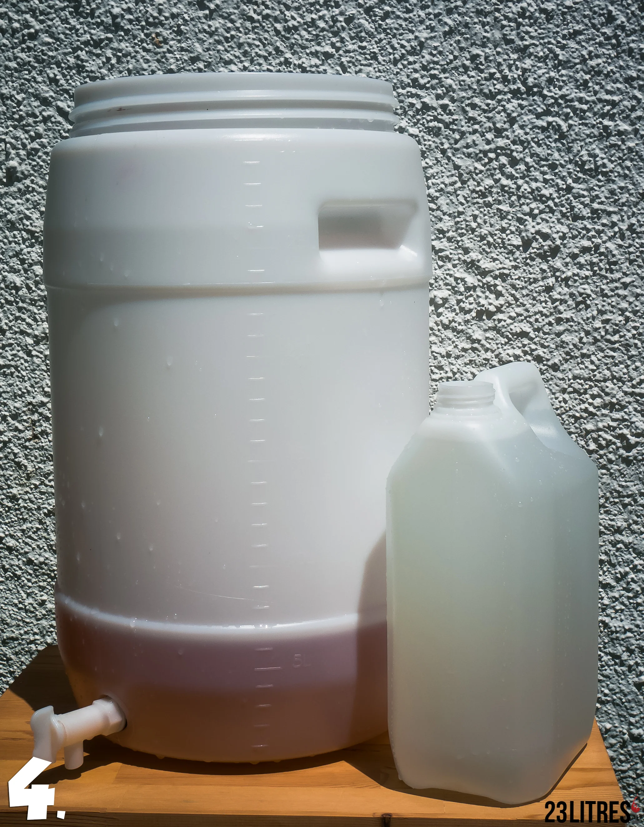 Once all the grape juice concentrate has been poured into the fermenter, prepare water to fill it up.