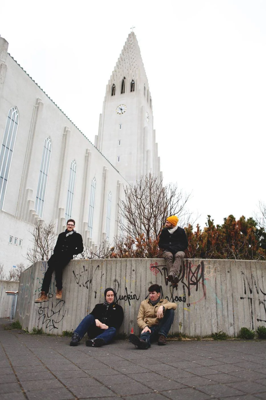 Lounging outside of Hallgrímskirkja with some local graffiti.