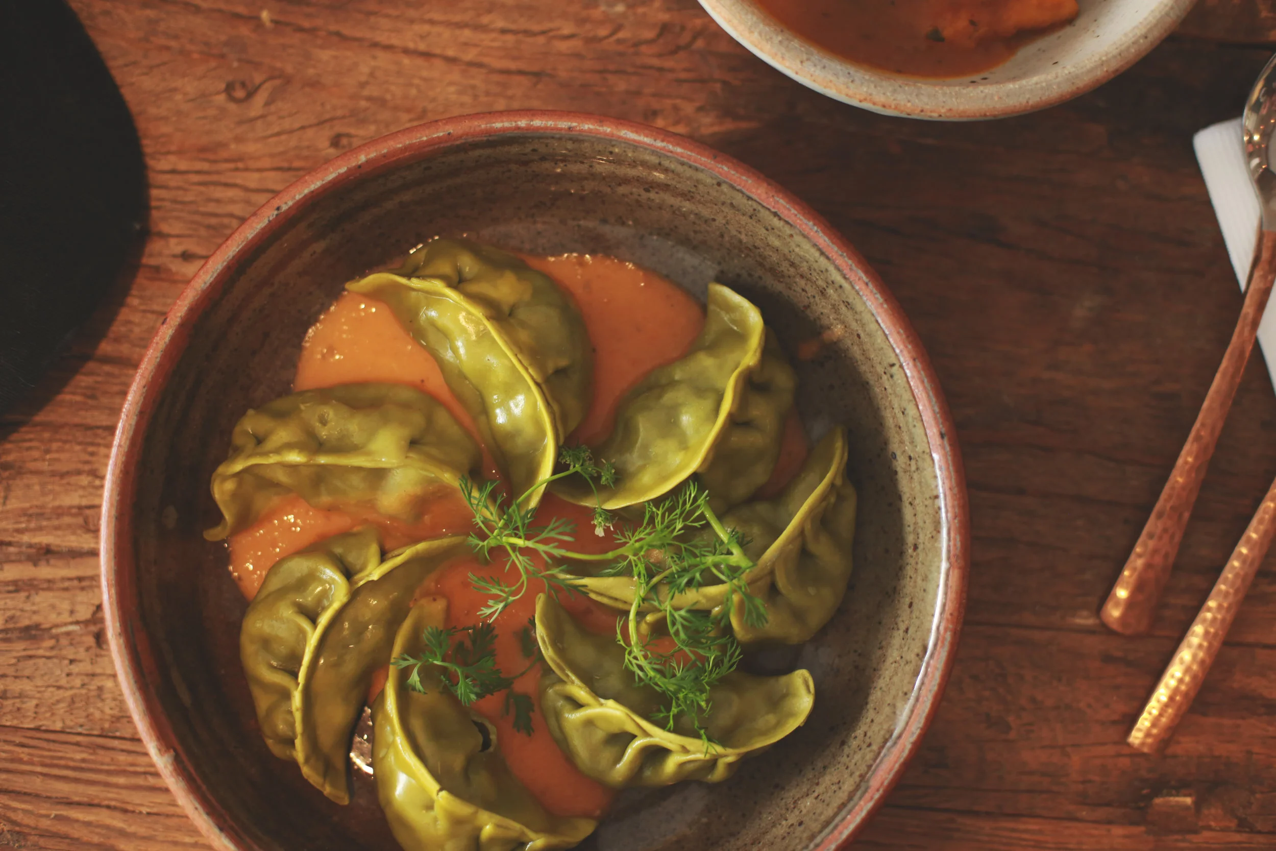 The vegetable momos, filled with yu-choy green, potatoes, and spices.