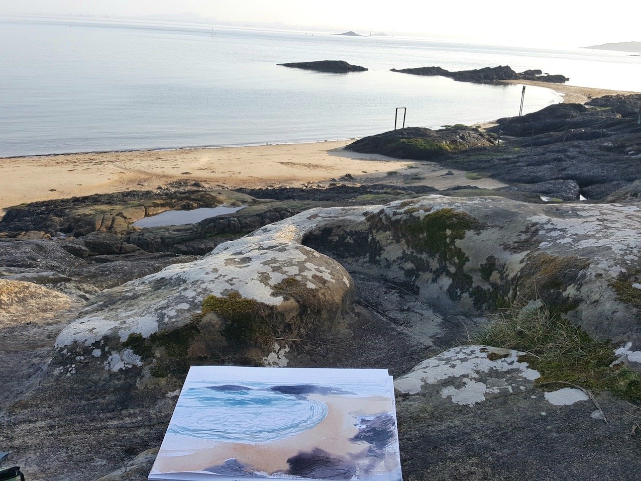 Painting on the rocks Aberdour, Scotland