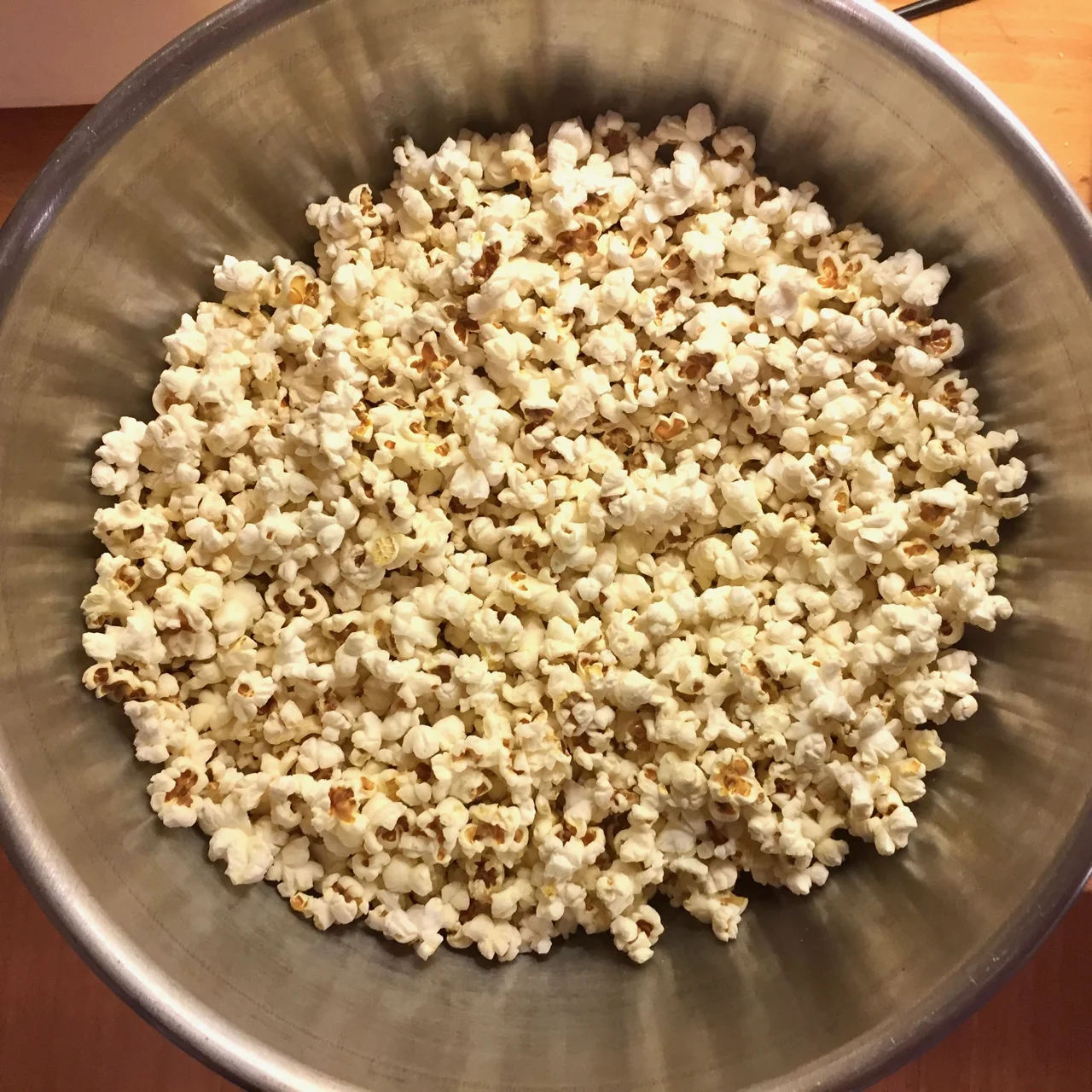 A giant bowl of popcorn, the perfect canvas for a loaded popcorn dinner.
