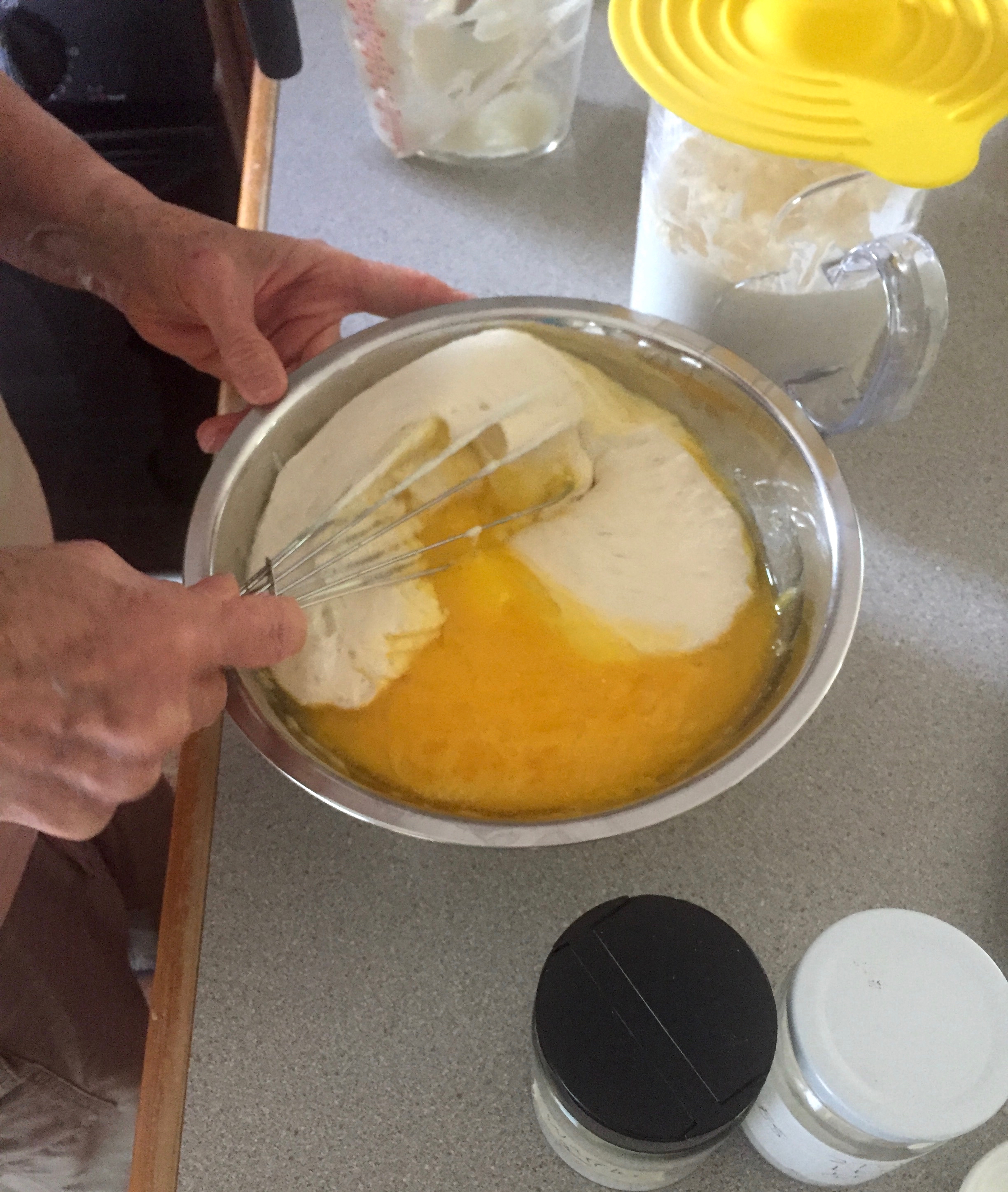 Adding eggs to the batter, just before cooking