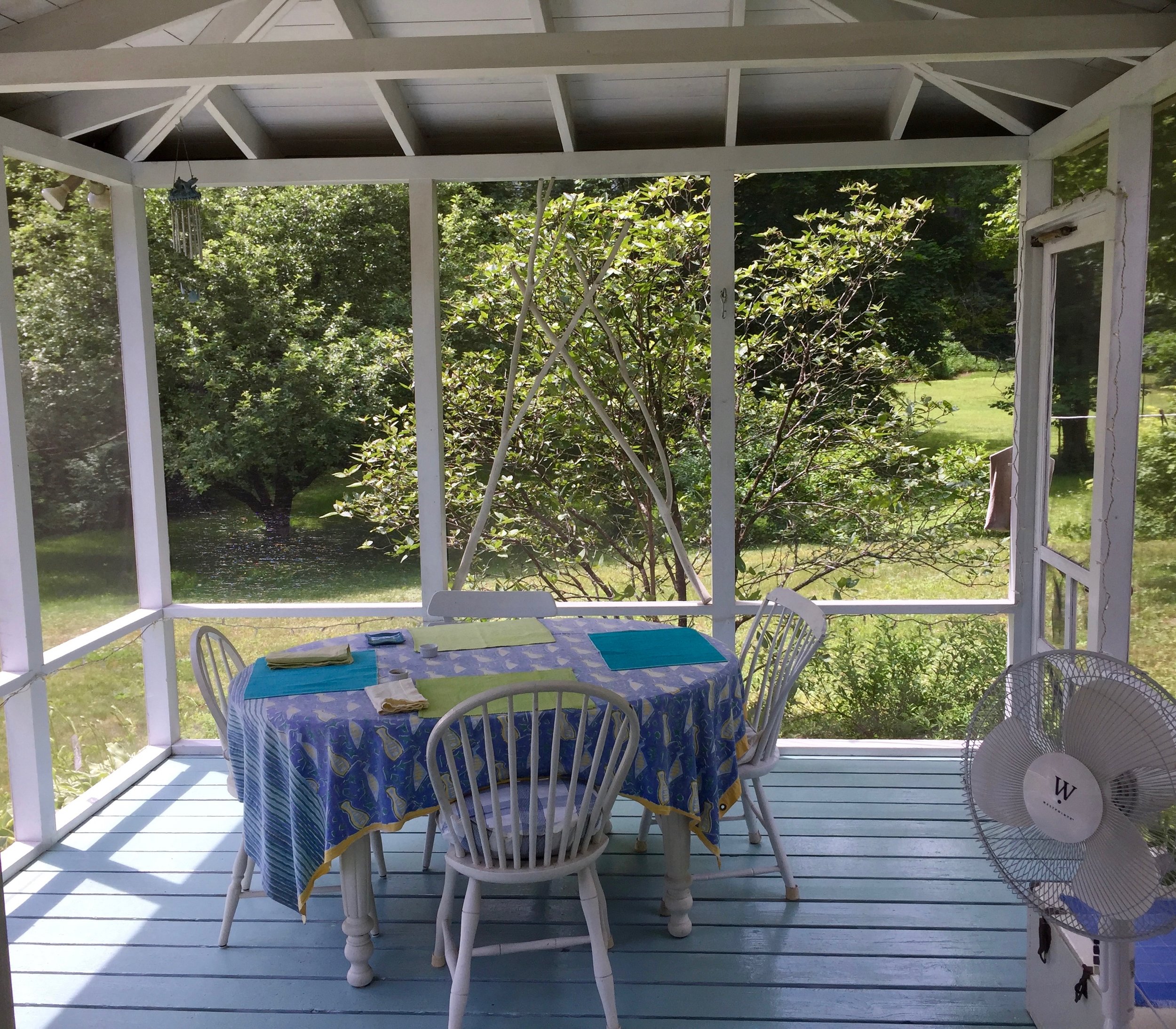 The sun porch where one breakfast is served at the Rock River Cabin